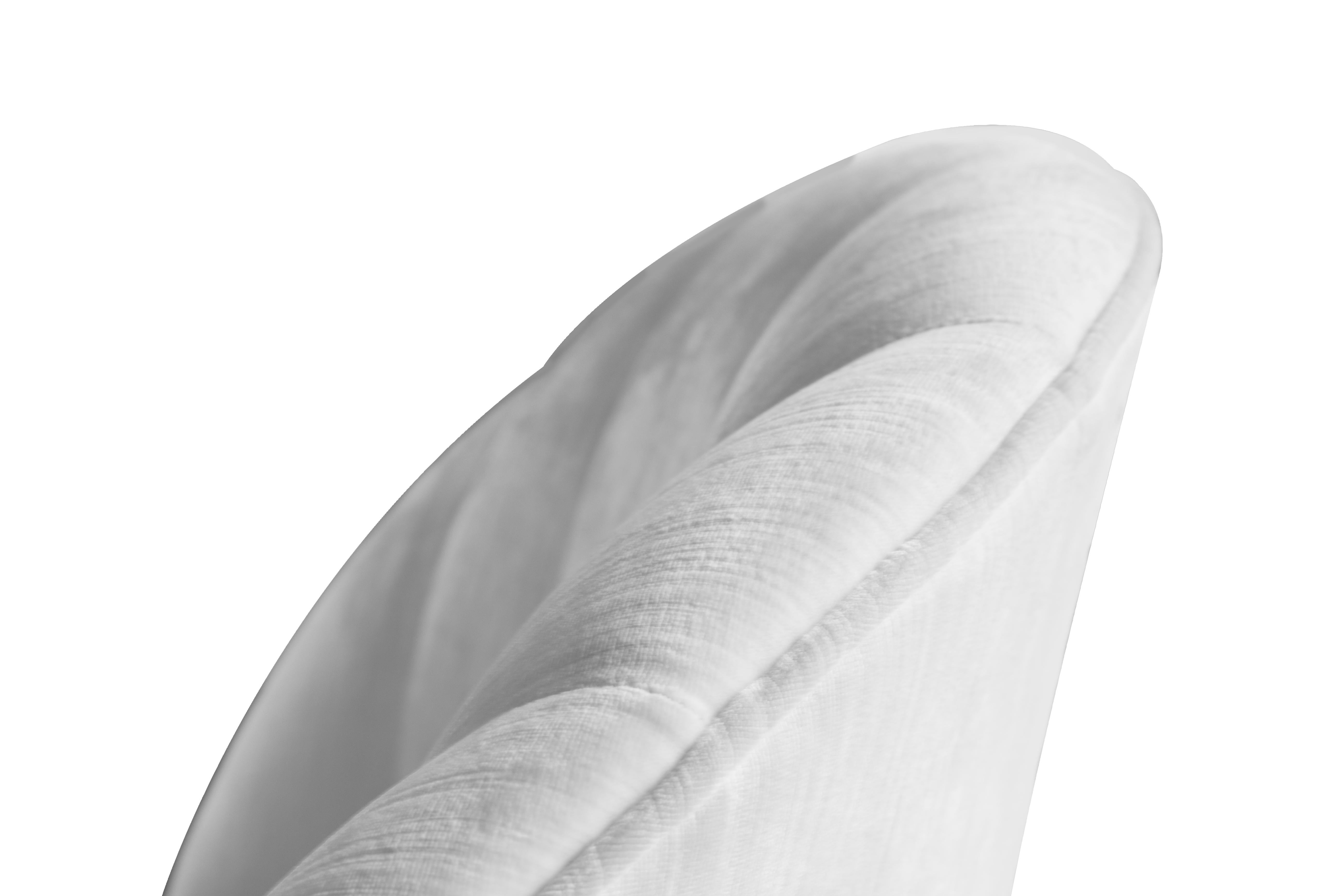 Gable is a sofa chair inspired in the heartthrob icon Clark Gable. It is upholstered in a luxurious cotton velvet, sit-on-top of a polished brass cylindrical base that swivels. Its low back and armless structure offers a bohemian twist on a classic