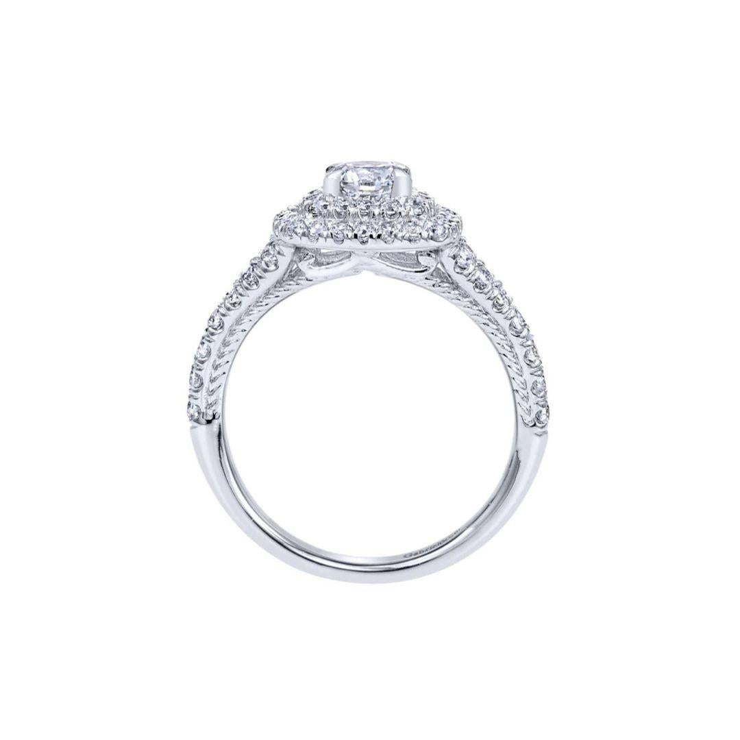 Ladies' 14k Diamond Engagement Ring﻿. Elegant double halo gives this ring a royal look, with beautiful pave diamonds on the sides tapering down to give this beautiful ring a romantic vintage appeal. Center diamond included, 0.45 ct, G color, SI1