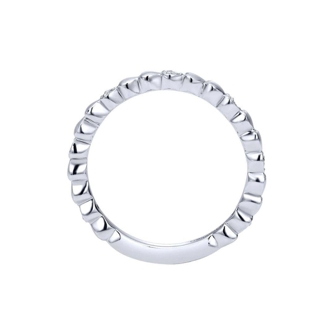 Satin finish stylized scallops reminisce of the shape of a lover's heart. Alternating with encrusted diamonds, this band has a stylish organic flow with a modern romantic flair. Band contains 0.08 ctw of fine white round diamonds, H color, SI