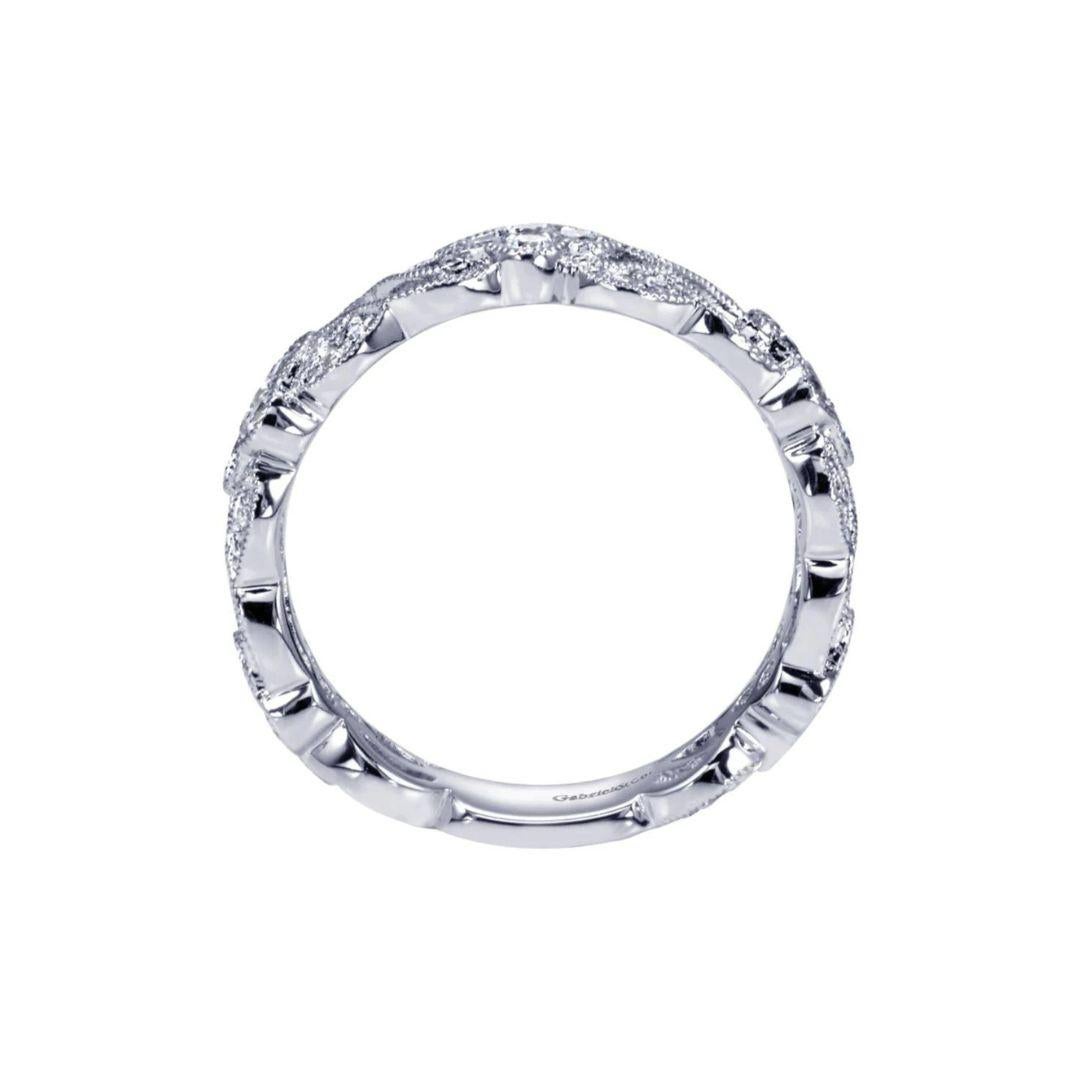 Intricate design with a lot of detail and open space make this band truly one of a kind. Band contains 0.45 ctw of fine white round diamonds, H color, SI clarity, set in 14k white gold. Band is suitable as a fashion ring, anniversary ring, a wedding