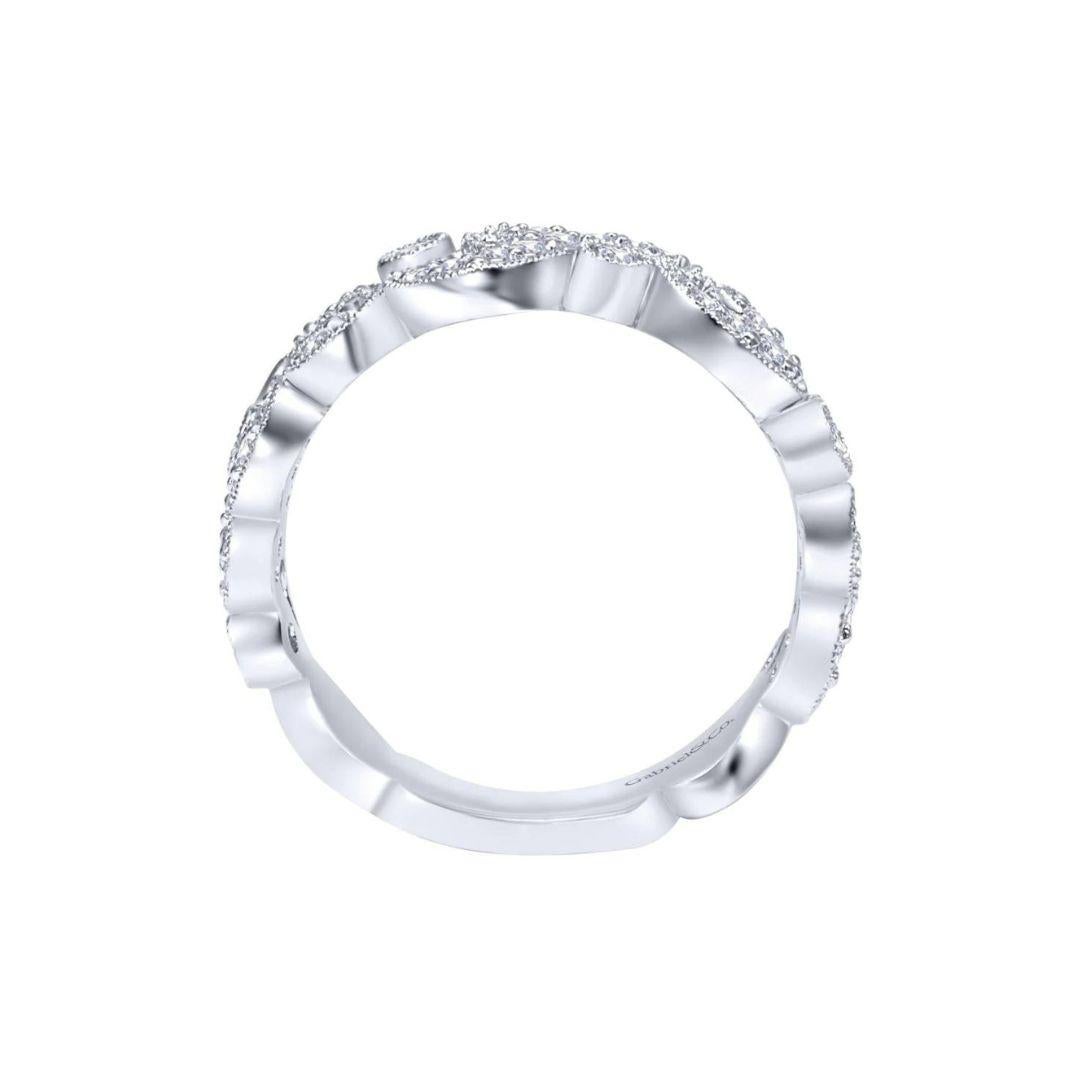 Open weave with studded round diamonds and delicate milgrain finish create a romantic and feminine look on this band. Band contains 0.43 ctw of fine white round diamonds, H color, SI clarity set in 14k white gold, and is suitable as a fashion ring,