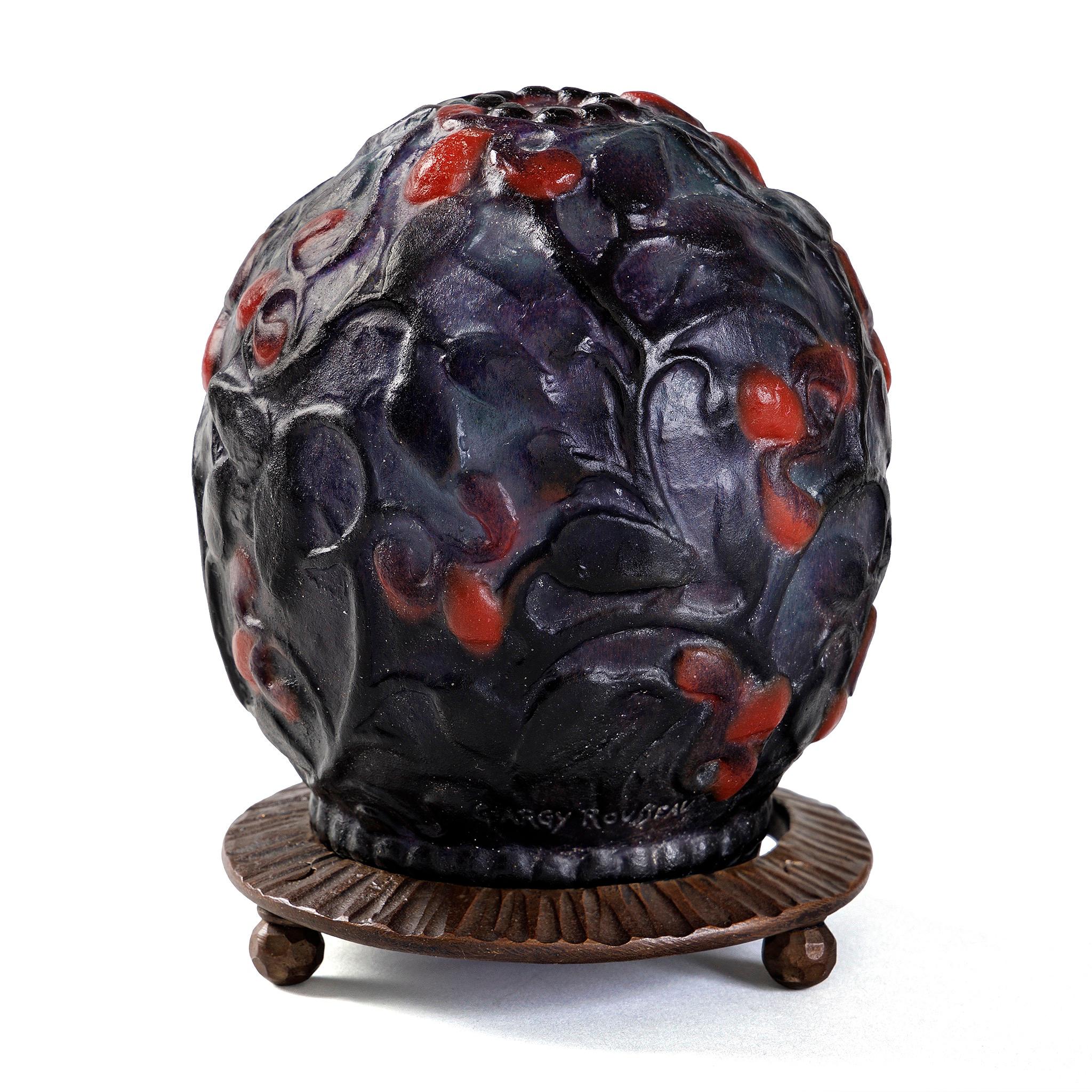 Argy-Rousseau's near-unique ability to gracefully soften the starkness of Art Deco design without ever sacrificing the strength of the design is on full display in this remarkable, petite masterpiece. Argy Rousseau's Fruits et Feuilles nightlight