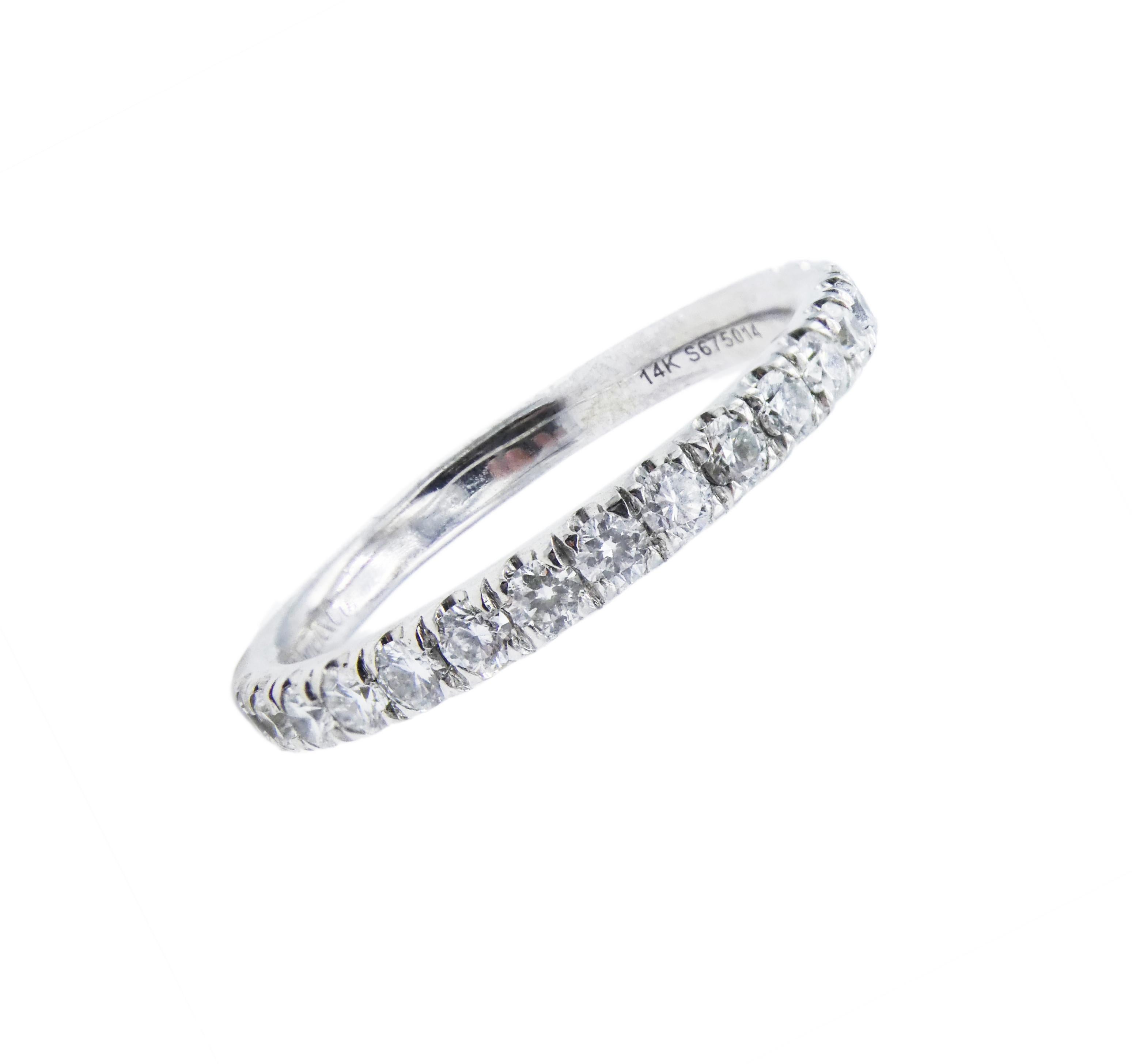14 Karat Diamond Wedding Band 0.50 CTW White Gold Half Ring Size 6

Metal: 14k White Gold
Weight: 2.17 grams
Diamonds: 17 round brilliant cut diamonds, approx. .50 CTW G VS
Size: 6 (US)
Width: 2.4MM
