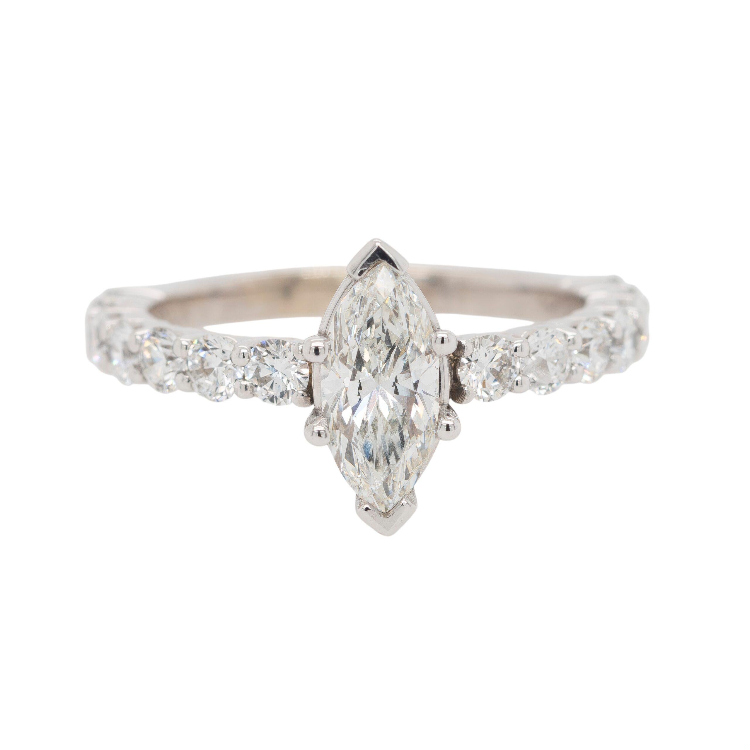 This stunning engagement ring by Gabriel & Co. features a captivating 0.94-carat marquise-cut diamond as its centerpiece. Graded H color and SI1 clarity, the diamond is certified by HRD (16005111020) with VG polish, good symmetry, and no