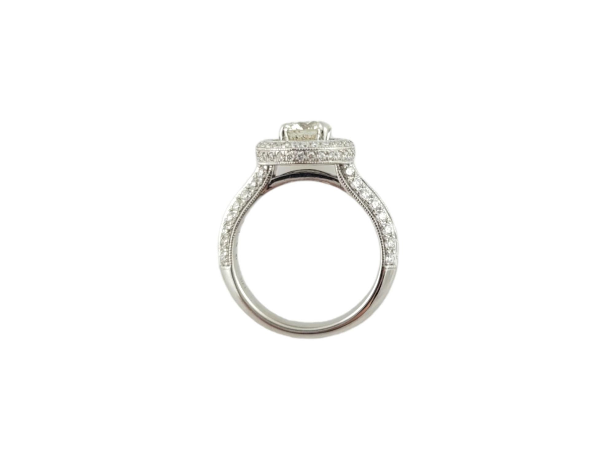 Vintage 14K White Gold Gabriel & Co. Diamond Halo Engagement Ring 

This halo style diamond engagement ring is set in 14K white gold. 

Center diamond is approximately .68cts  and of I1 clarity and L color

Surrounding diamonds on halo and band