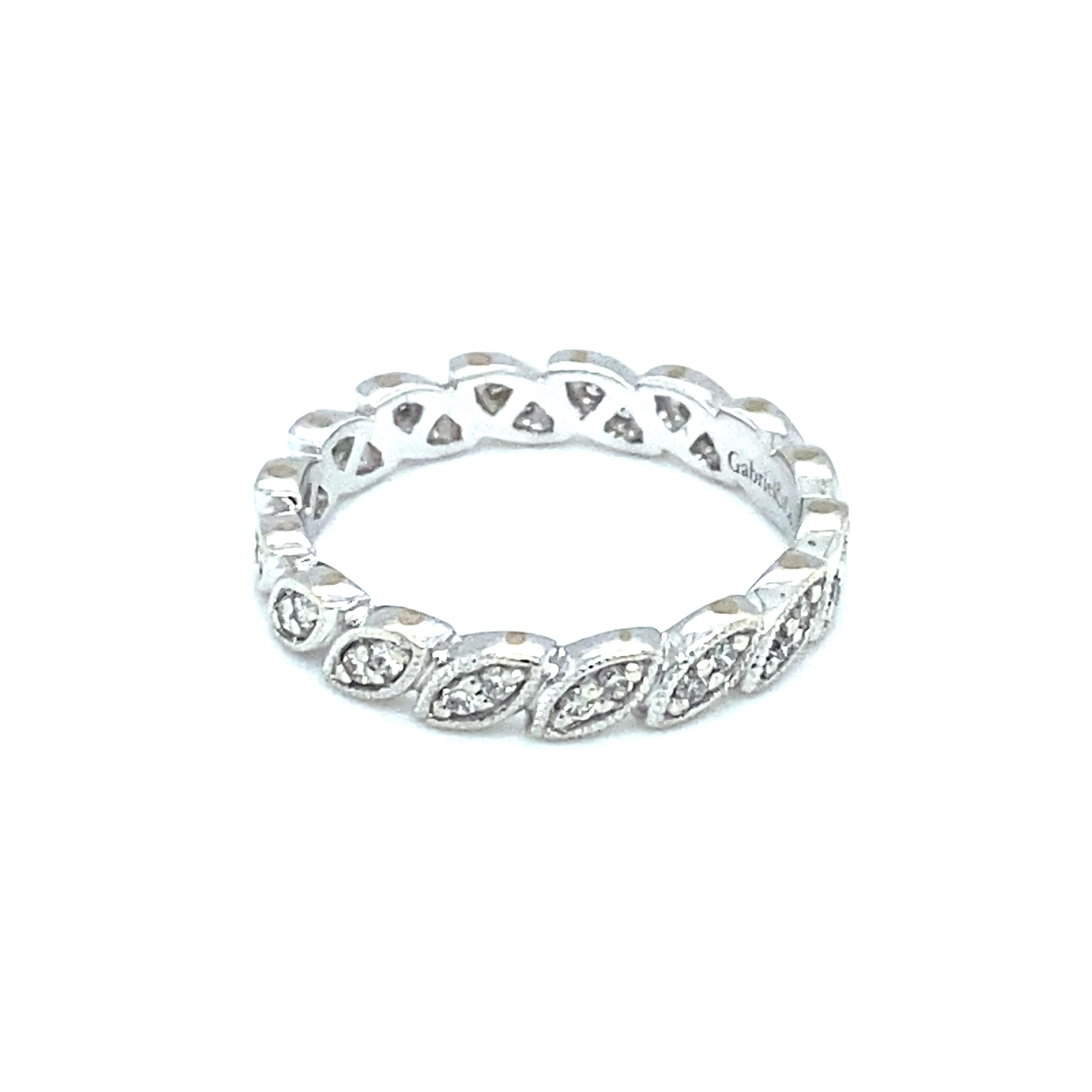 Item Details: This petite ring by Gabriel & Co. features a marquise shape eternity band with round diamonds, all prong set and an empty space for slight resizing (1-2 sizes) if needed.

Circa: 2000s
Metal Type: 14 Karat White Gold
Weight: 2.0