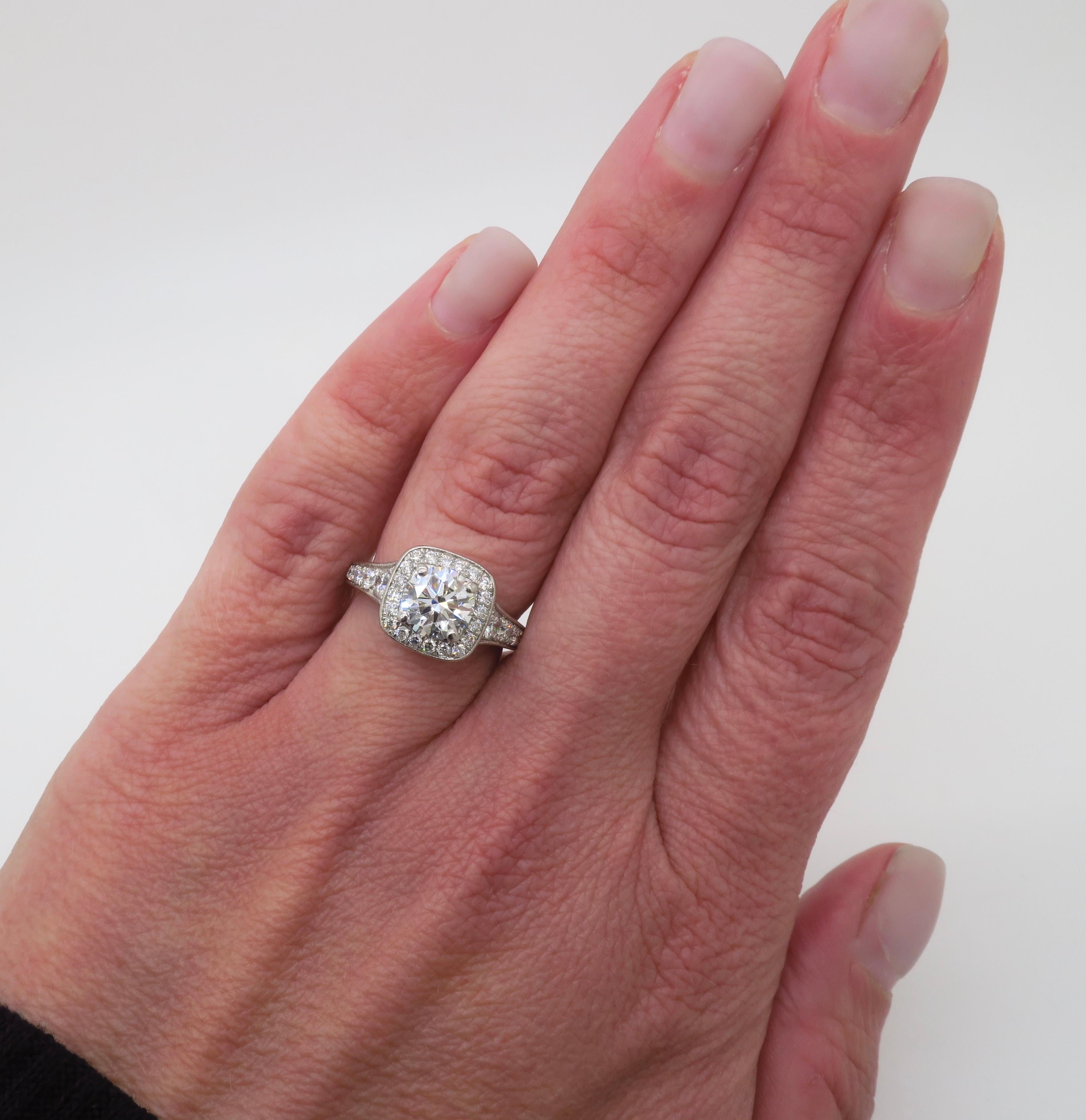 Elegant Gabriel & Co. Certified Halo Diamond engagement ring made in Palladium. 

Center Diamond Carat Weight: 1.24CT Earth Mined  
Center Diamond Cut: Round Brilliant Cut 
Center Diamond Color: I
Center Diamond Clarity: VS2
Certification: AGS: