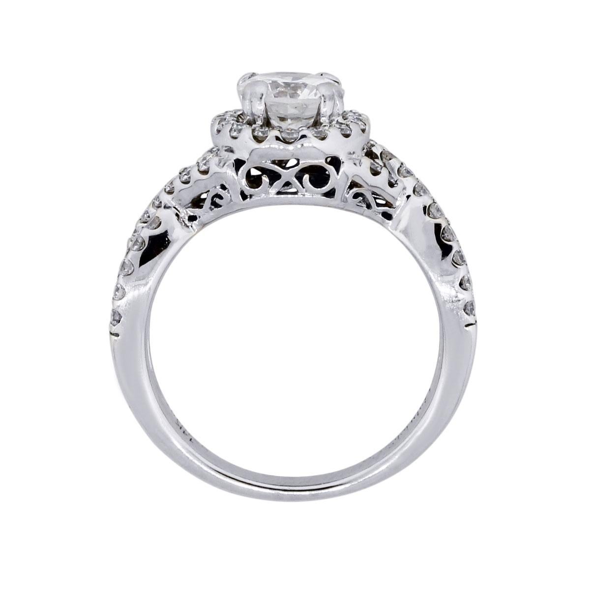 Material: 14k white gold
Main Diamond Details: Round brilliant diamond approximately 0.90ct. Diamond is H in color and I1 in clarity
Mounting Diamond Details: Approximately 0.75ctw of round brilliant diamonds.
Ring Size: 6.5 (can be sized)
Ring