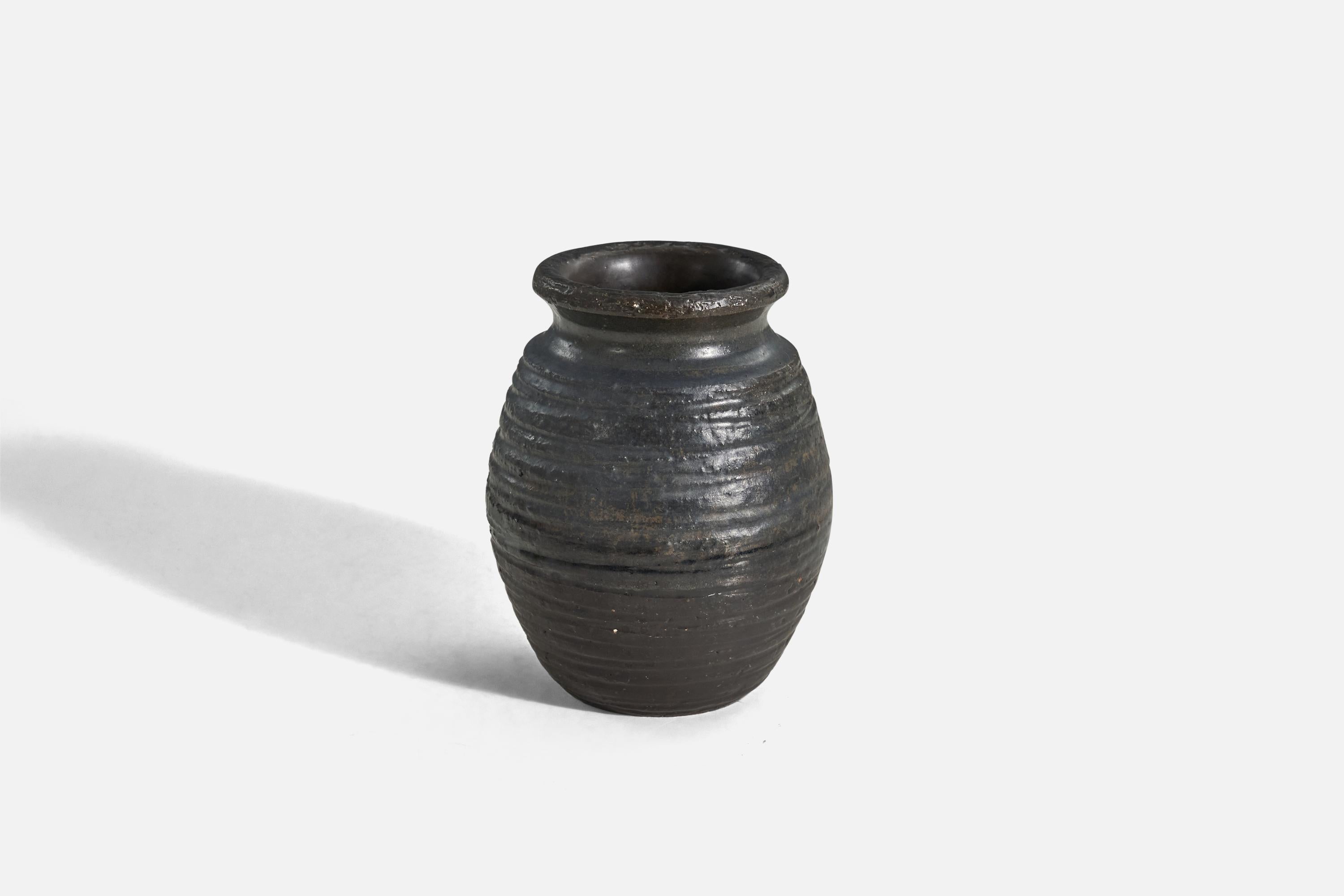 A black-glazed earthenware vase designed and produced by Gabriel Keramik, Sweden, c. 1940s.