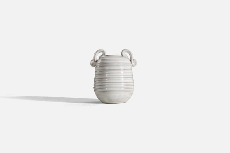 A white, glazed earthenware vase designed and produced by Gabriel Keramik, Sweden, c. 1930s.