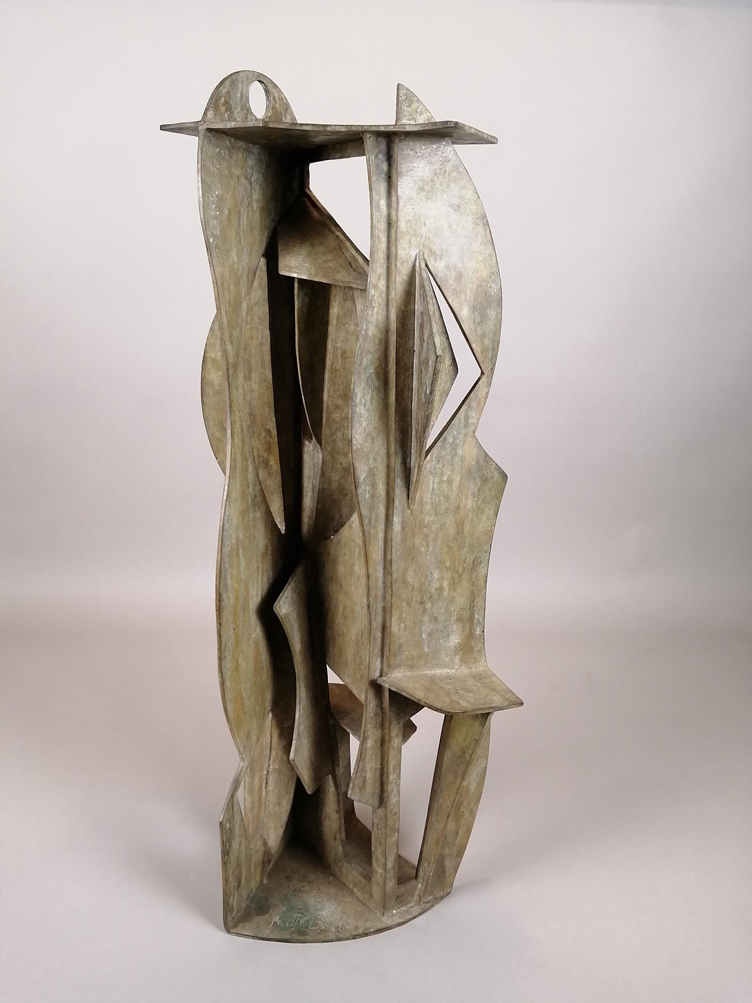 A geometric bronze sculpture by Mexican artist Gabriel Macotela named 