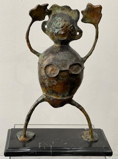 Scultura in bronzo a due facce intitolata "Niño-Niña (ragazzo-ragazza)".