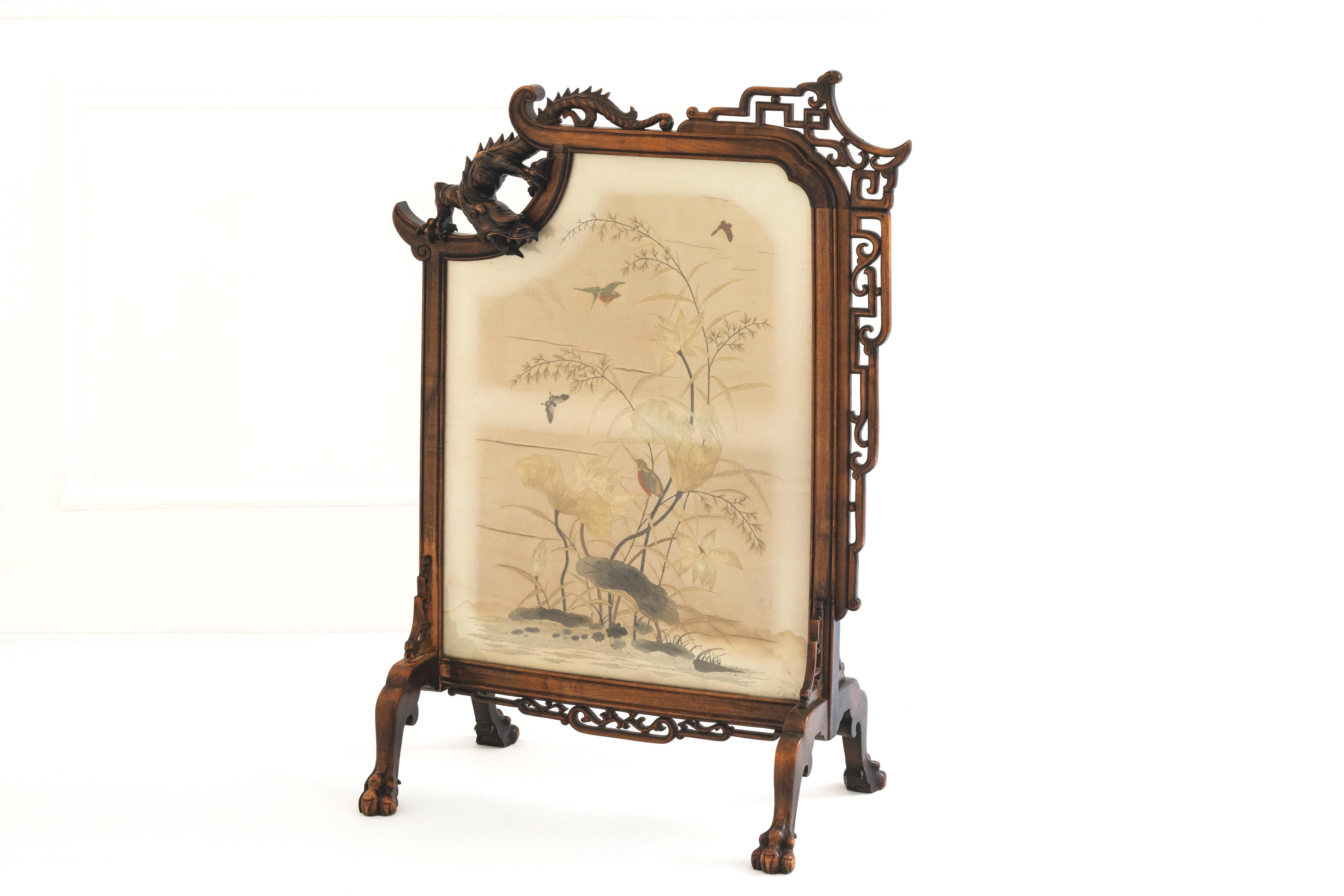 This beautiful 19th century rectangular mantel screen in stained wood attributed to Gabriel Viardot, showcases exquisite craftsmanship typical of his work. It is carved with a dragon on the left, open work scrolls in the sino japanese style on the