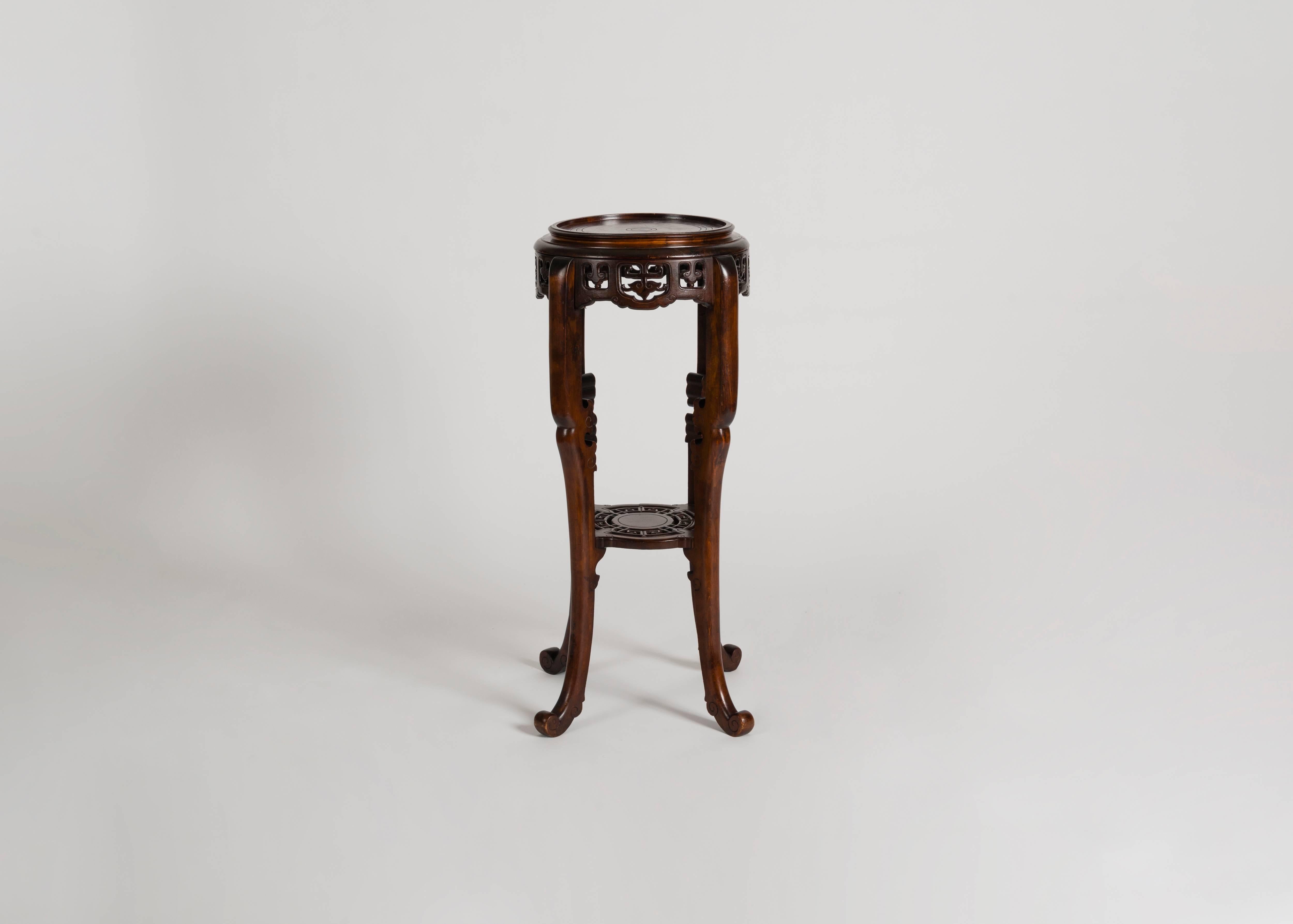 Signed.

A two-tiered, tall side table by Gabriel Viardot, a French cabinetmaker whose elaborate carvings and use of eastern motifs propelled him to fame in the late 19th century.