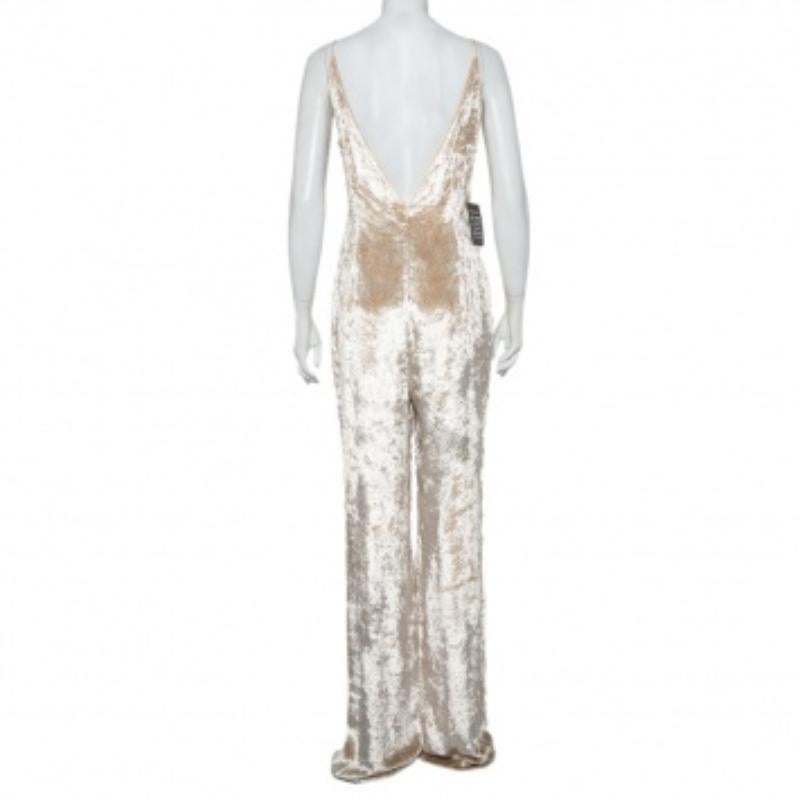 Gabriela Hearst's jumpsuit is the perfect alternative to a formal dress. It is crafted from luxurious patterned velvet in a sleeveless style and the bottoms are cut to a wide silhouette. Look stunning in this jumpsuit as your style it with high