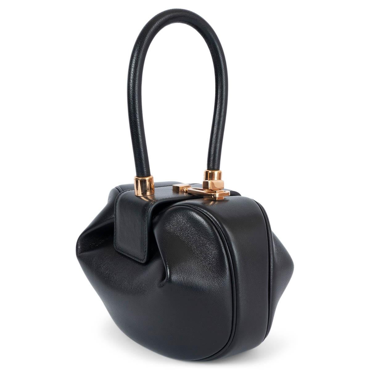 100% authentic Gabriela Hearst Demi Bag made of smooth lambskin leather and features a structured top handle with a distinctive round pouch that gently unfolds from a turn lock closure. Has been carried once and is in virtually new condition. LC