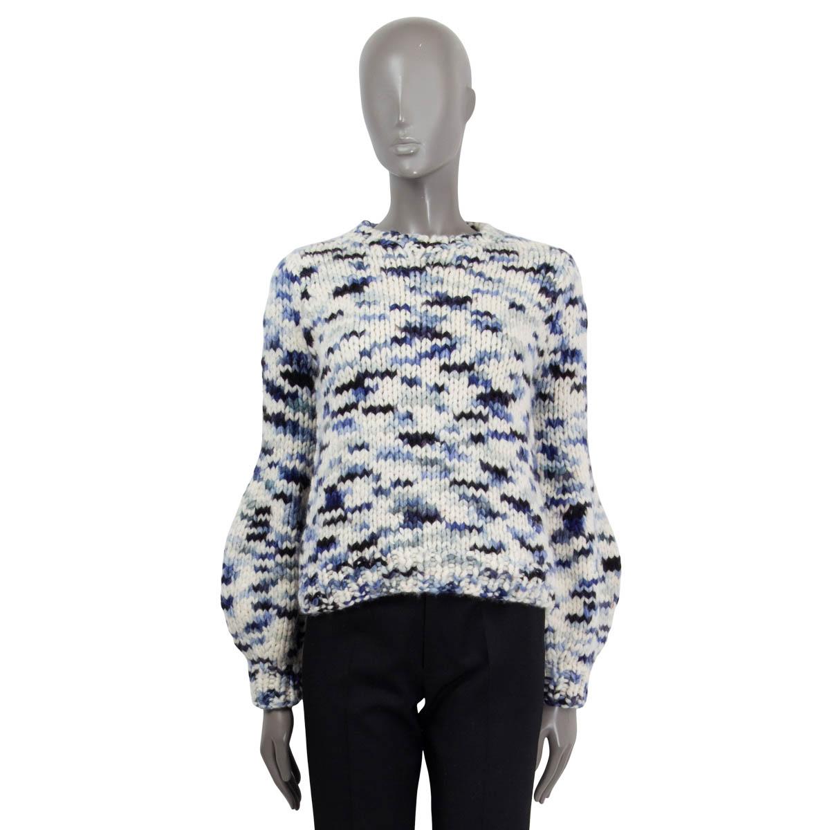 This 100% authentic Gabriela Hearst Clarissa sweater in ivory and gradient blue space-dyed cashmere is inspired by the coastal landscapes of Uruguay. It features a thick braid-knit design, a classic crewneck, and elegant lantern sleeves, combining