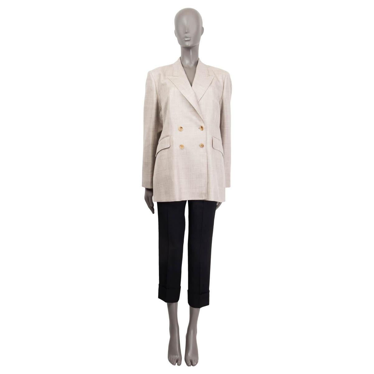 100% authentic Gabriela Hearst 'Angela' double breasted blazer in cream wool (49%), silk (30%) and linen (21%). Features peak lapels, two flap pockets and buttoned cuffs. Opens with two buttons on the front. Lined in off-white silk (100%). Brand