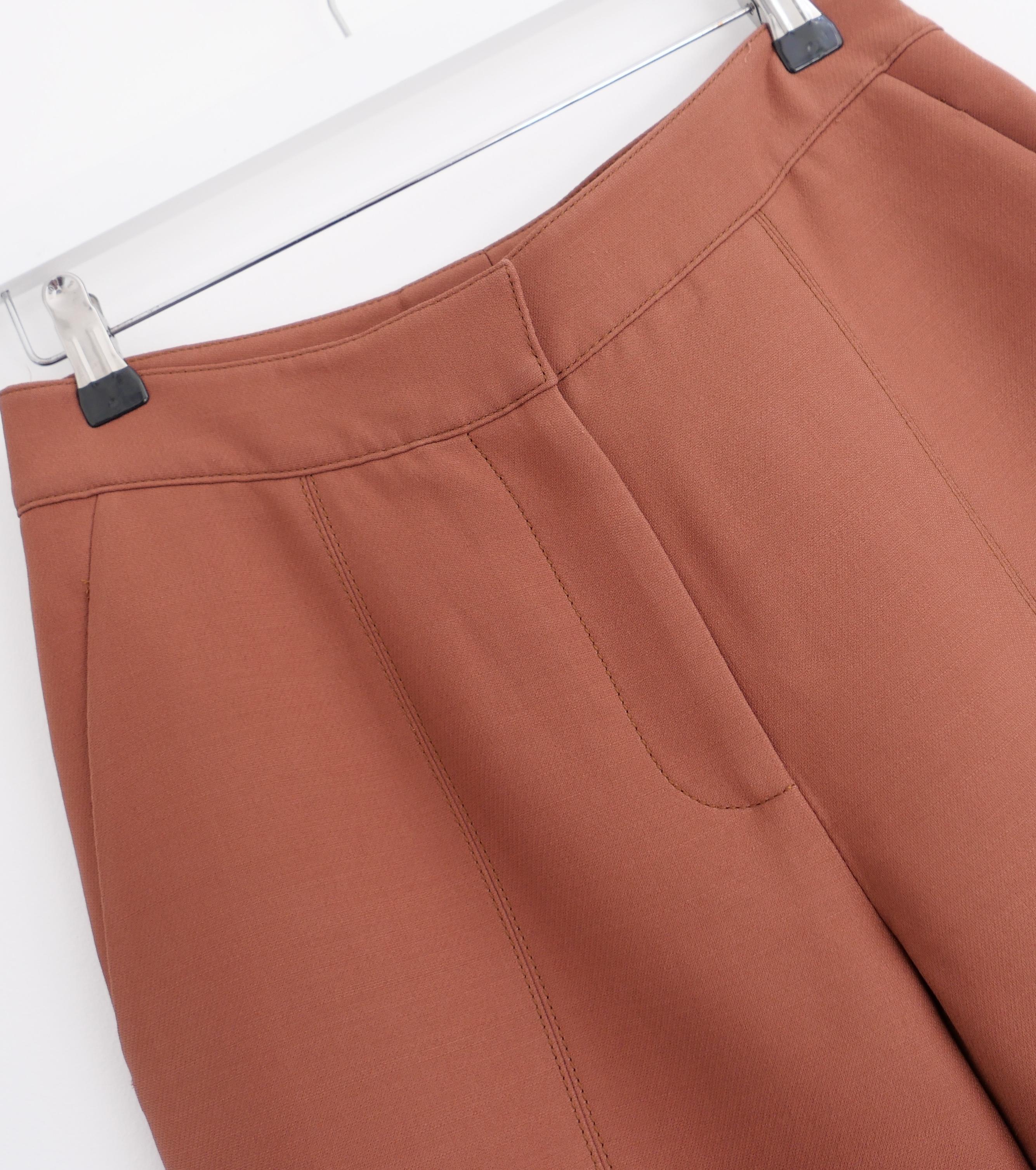 Superbly constructed Gabriela Hearst flared trousers - bought for £1000 and worn less than a handful of times. Matching Sawyer jacket also listed. Made from thick, structural rust brown wool and silk cady, they have a flared hem cut with high waist