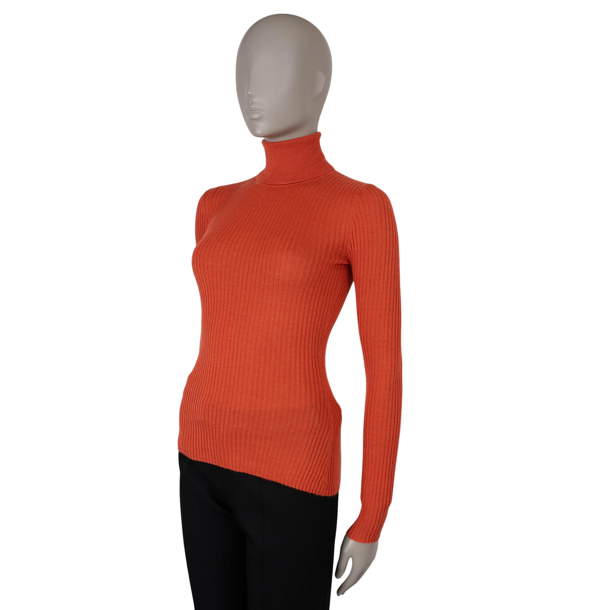 This 100% authentic Gabriela Hearst Peppe sweater in Spice (pumpkin orange) rib-knit cashmere (70%) and silk (30%) is a luxurious wardrobe staple. Featuring a slim fit and a classic turtleneck, it combines cozy elegance with a vibrant pop of color,