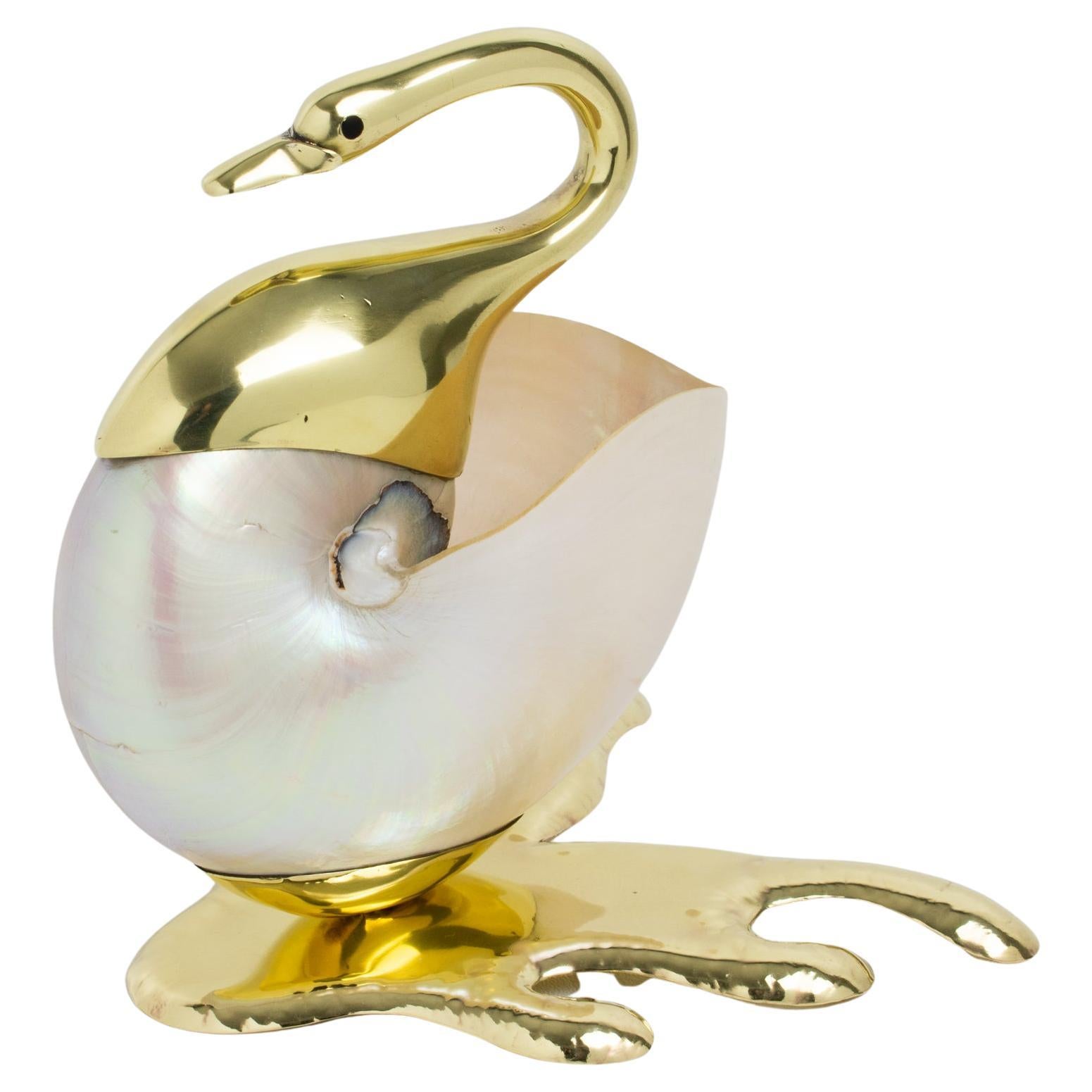 Presented here is a beautiful large seashell swan sculpture or decorative bowl. The design is reminiscent of Italian artist Gabriella Binazzi's work. The swan neck and base are gilded brass metal in original shiny condition. The swan's face has