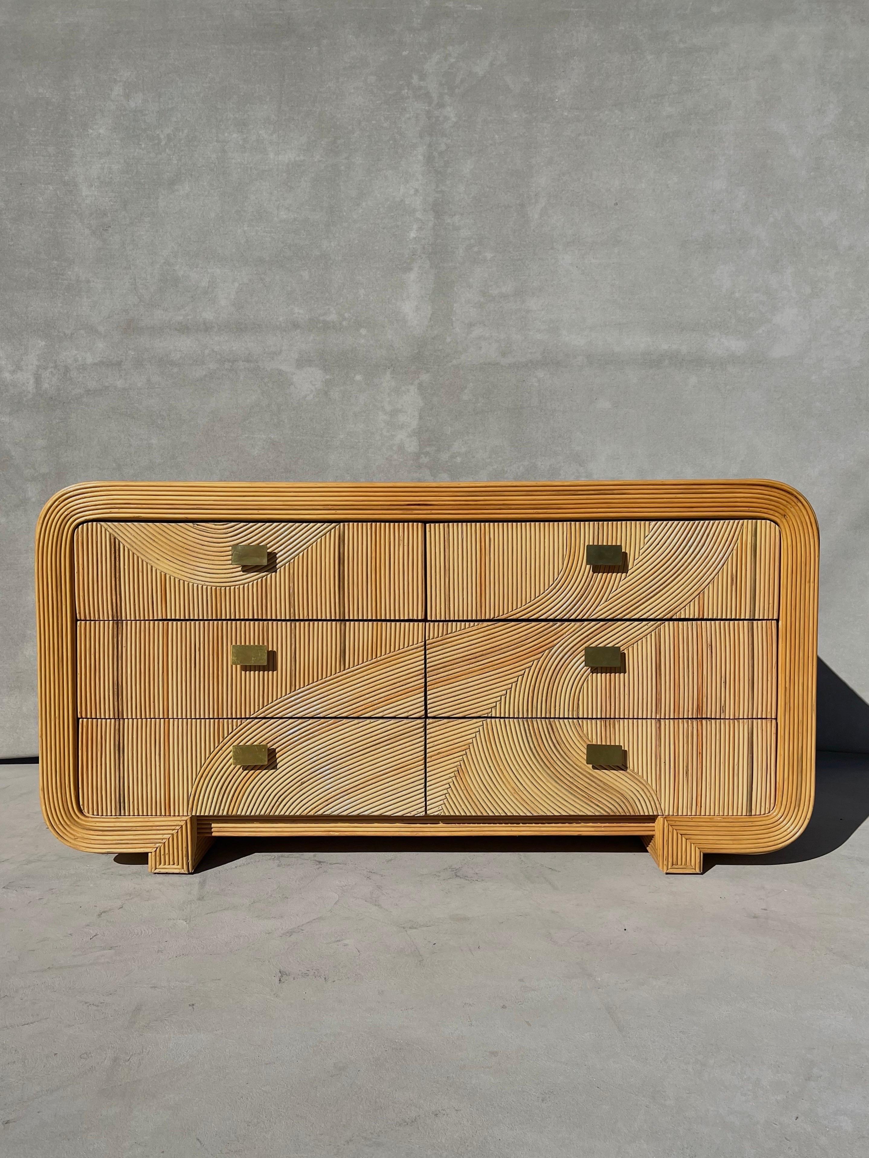 Gabriella Crespi attributed pencil reed and brass six drawer dresser, credenza or chest of drawers

A one of a kind piece- intricately handcrafted with curved and bent pencil reed in a variety of soft, welcoming colors. Colors of warm beiges, soft