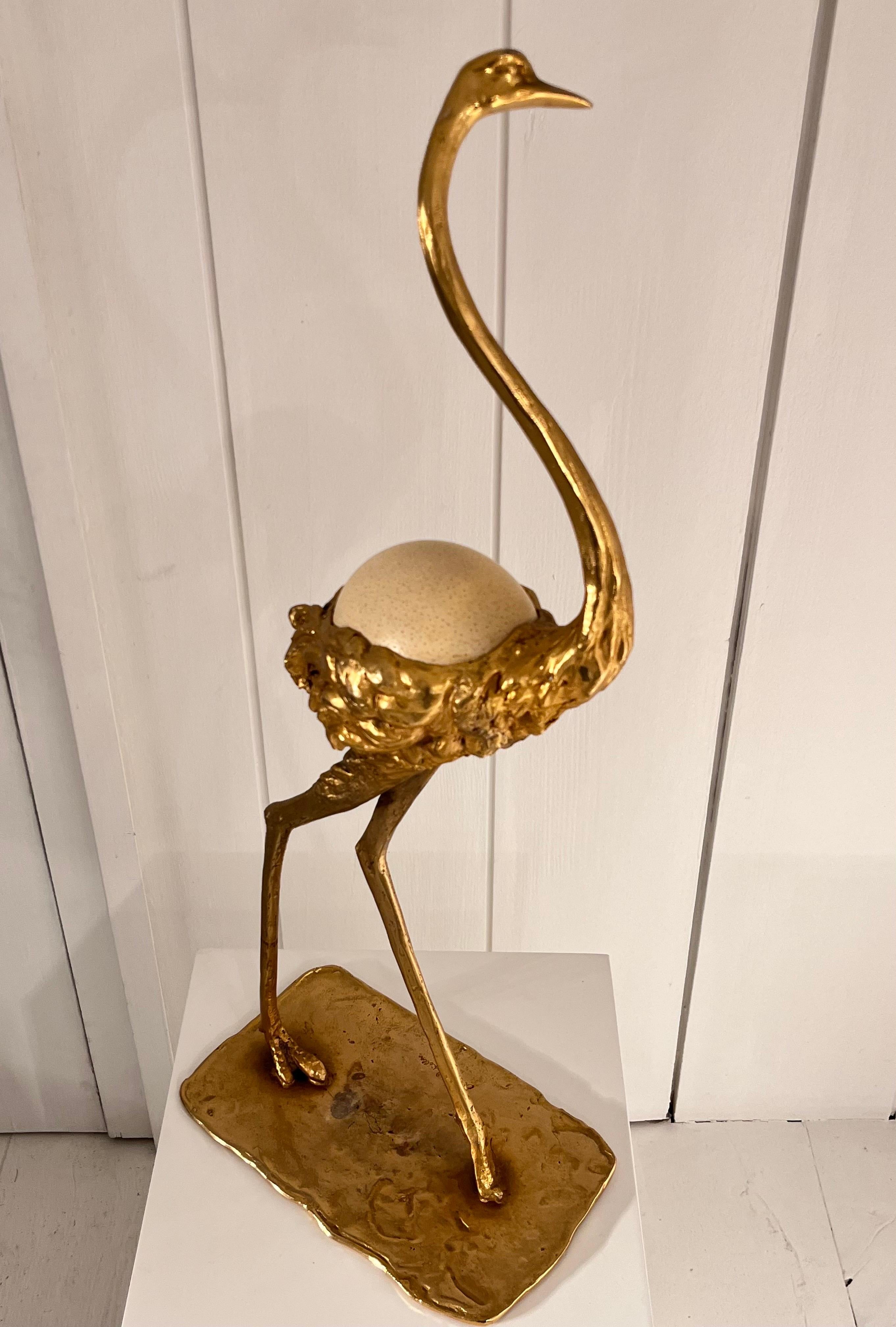 Airone sculpture
Gilt bronze, glass, resin ostrich egg 
Signed by the artist on the base
Circa 1973-1974
