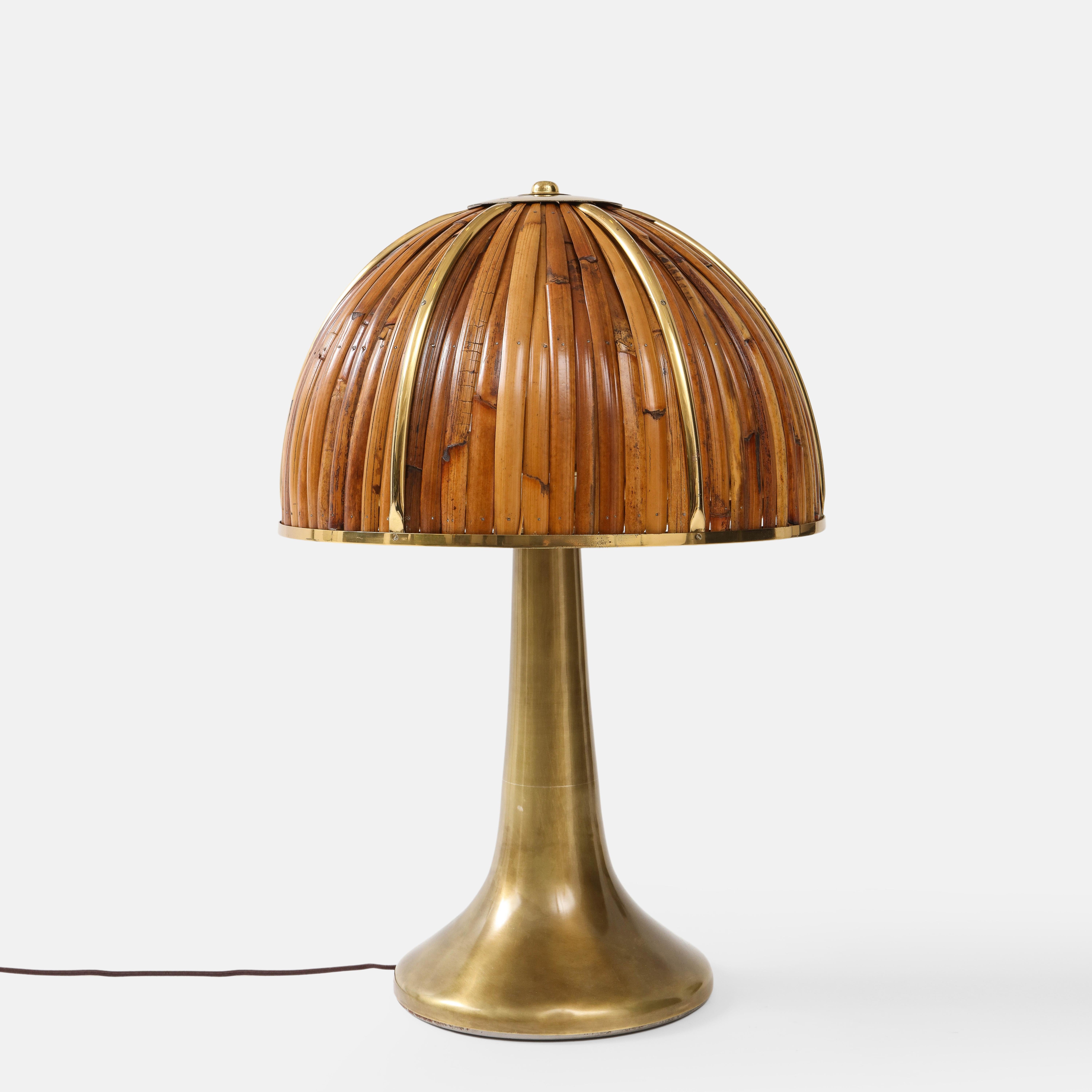 Gabriella Crespi rare 'Fungo' table lamp from the Rising Sun Series with lacquered bamboo strips and polished brass details on dome shade atop elegant flared brass base, Italy, 1970s. Impressed with facsimile signature and artist’s cipher to shade