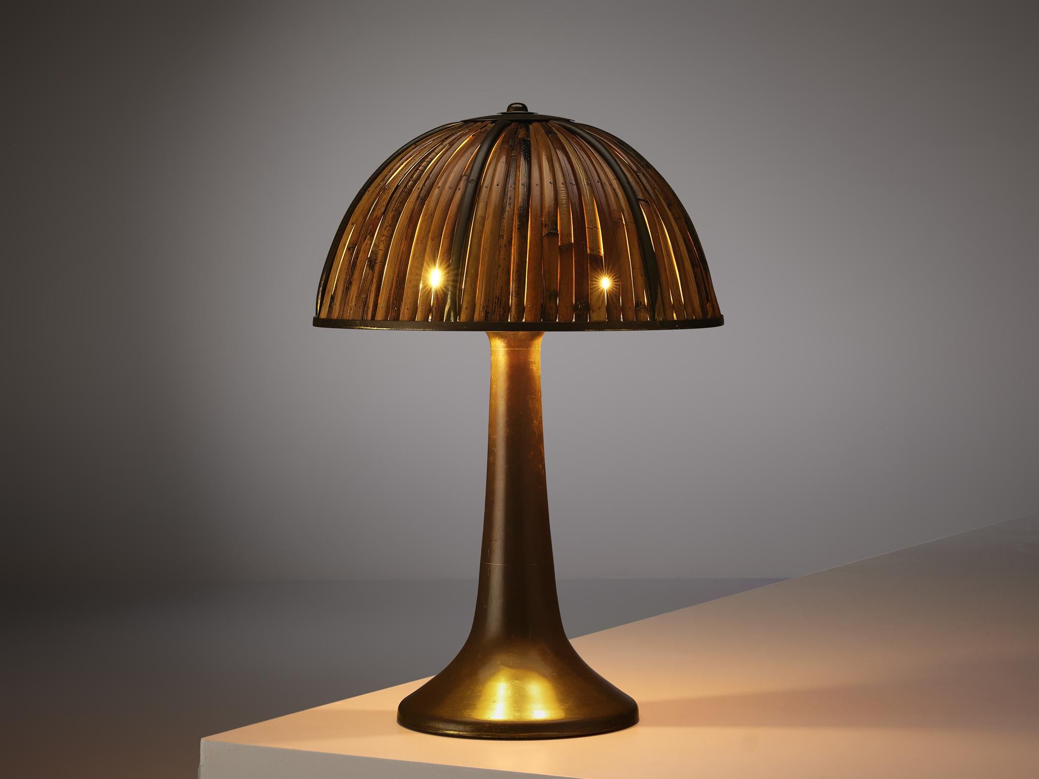 Gabriella Crespi, 'Fungo' table lamp, brass, bamboo, Italy, 1970s

The 'Fungo' table lamp was designed by Gabriella Crespi as part of the 'Rising Sun' series. On a brass stem that has a wide base and gets thinner towards the top a round lamp shade