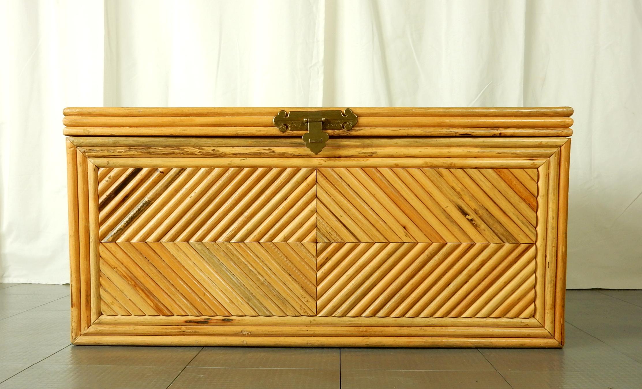 Diamond pattern split Rattan with woven reed top blanket chest.
Solid brass handles and center lid pull.
Artisan handmade. Inside is lined with solid wood.
Brass glides to hold lid open. Could be used as chest, coffee table or bench.
Exceptional