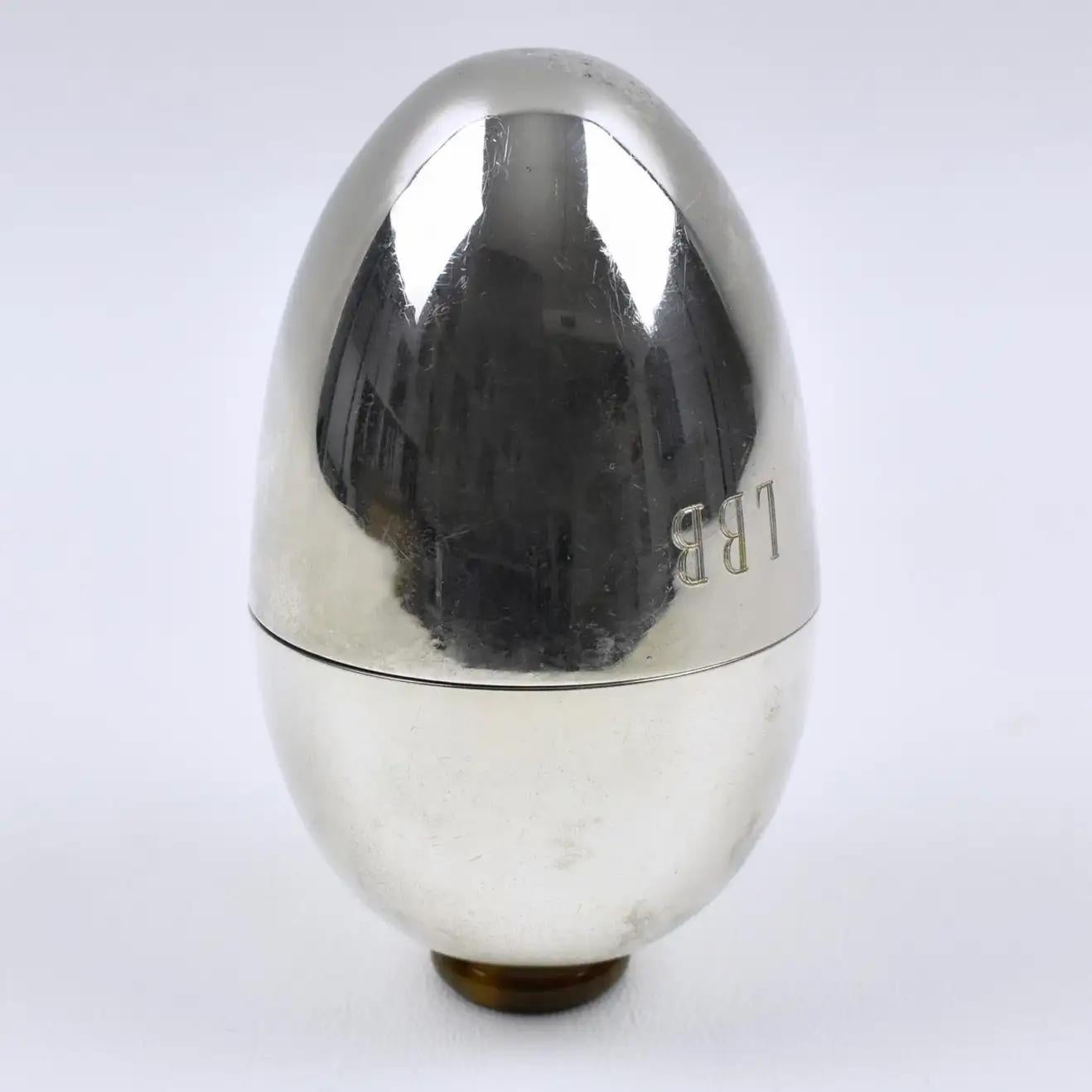 This exquisite 1970s silver plate sewing box was designed by Italian Gabriella Crespi (1922-2017). The streamlined egg-shaped opens in two with an almost complete interior insert. The monogram 