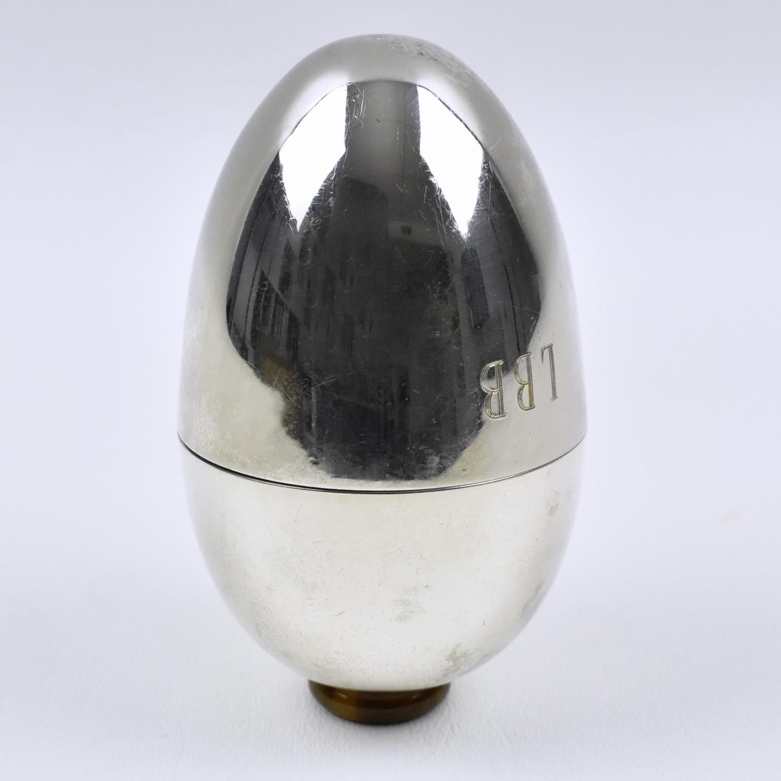 Italian designer Gabriella Crespi (1922 - 2017) created this exquisite silver plate sewing box in the 1970s. The streamlined egg-shaped opens in two with an almost complete interior insert. The monogram 