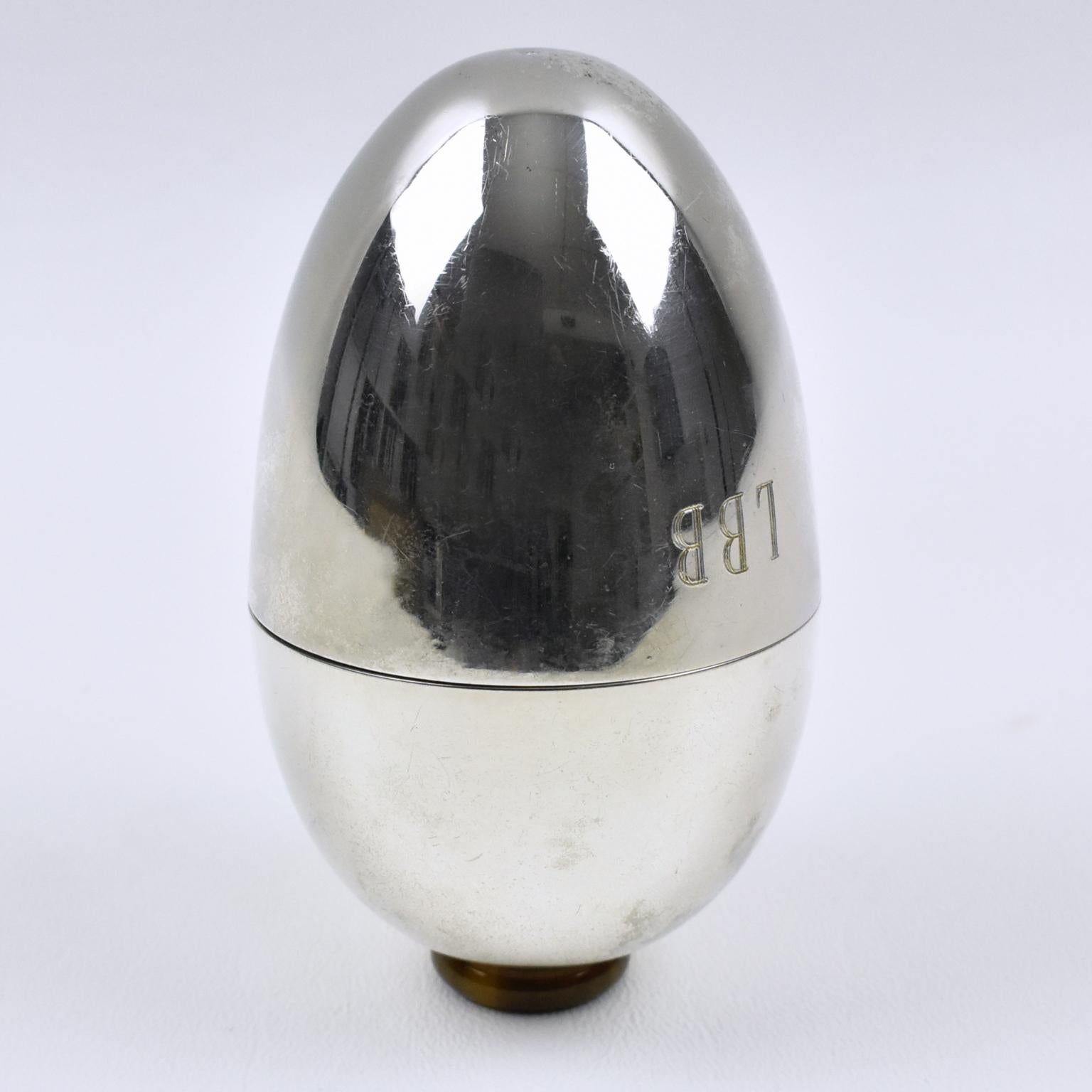 Italian designer Gabriella Crespi (1922 - 2017) created this exquisite silver plate sewing box circa 1970. The streamlined egg-shaped opens in two with an almost complete interior insert. The monogram 