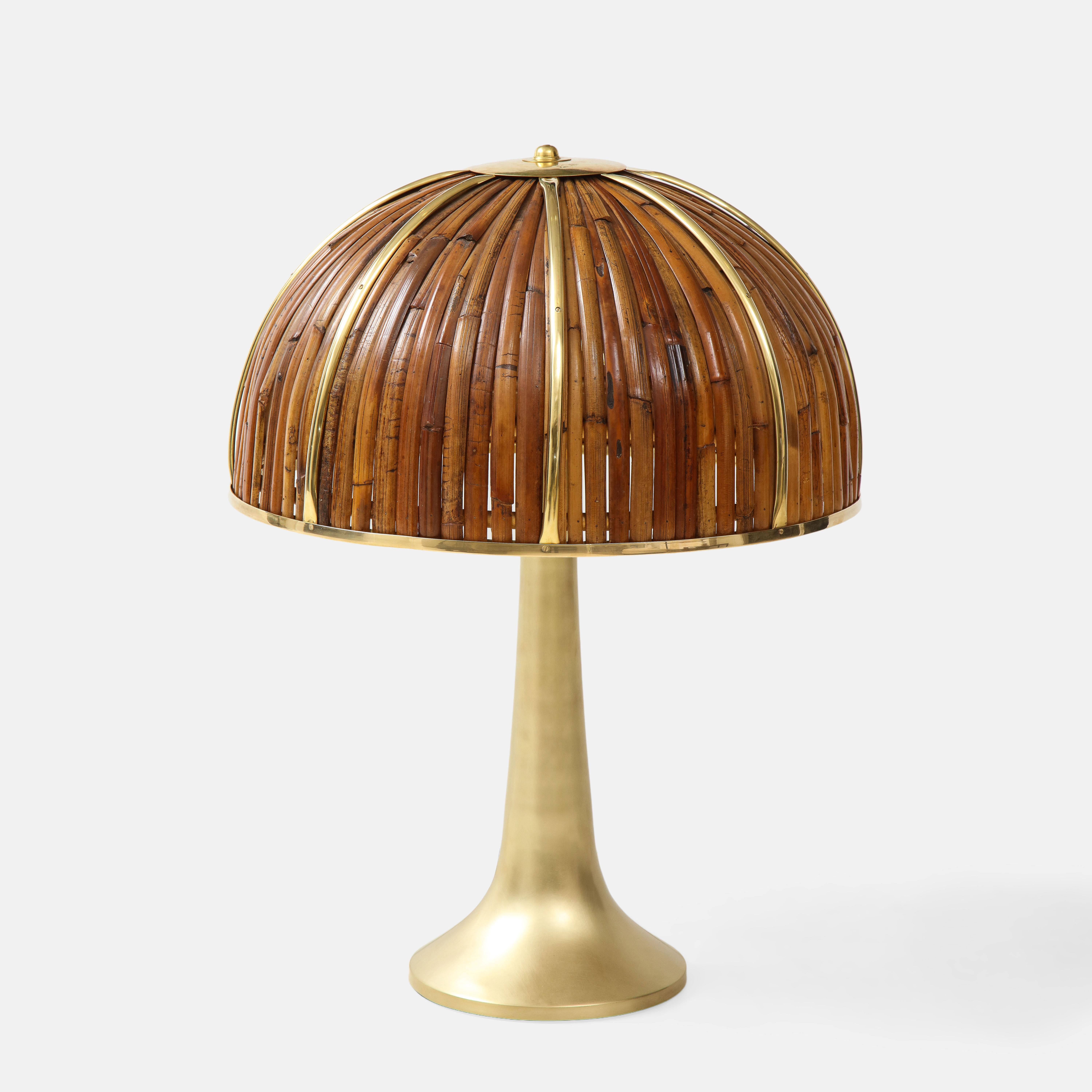 Large and rare 'Fungo' table lamp from the Rising Sun Series with lacquered bamboo strips and polished brass details on dome shade atop elegant flared brass base in a brushed gold finish, Italy, 1970s. Impressed with facsimile signature and artist’s