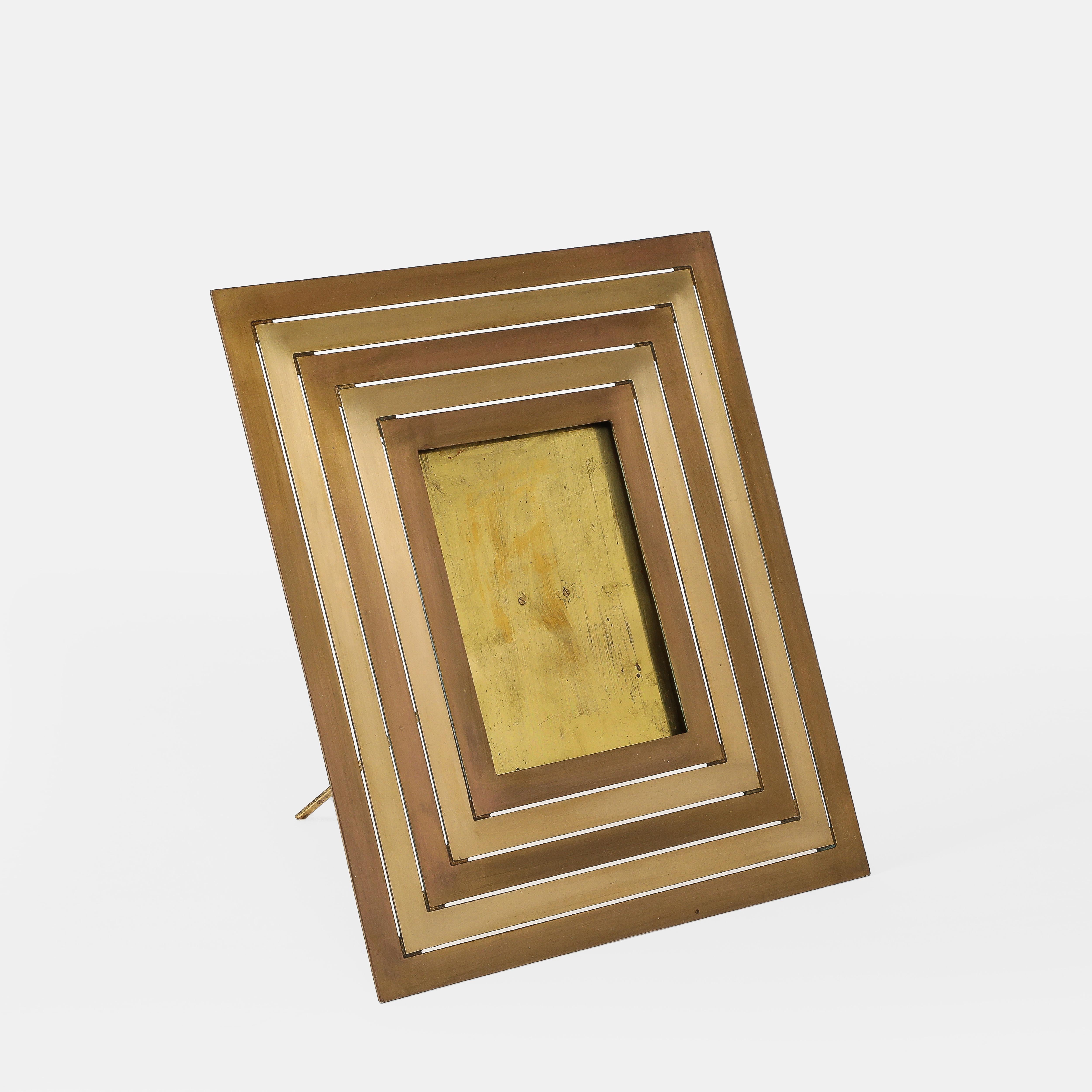 Gabriella Crespi large rectangular picture frame with alternating bands of polished and brushed brass, Italy, 1970s.  This incredibly chic picture frame is a striking example of the glamorous and iconic Crespi design of the 1970s.
Impressed with