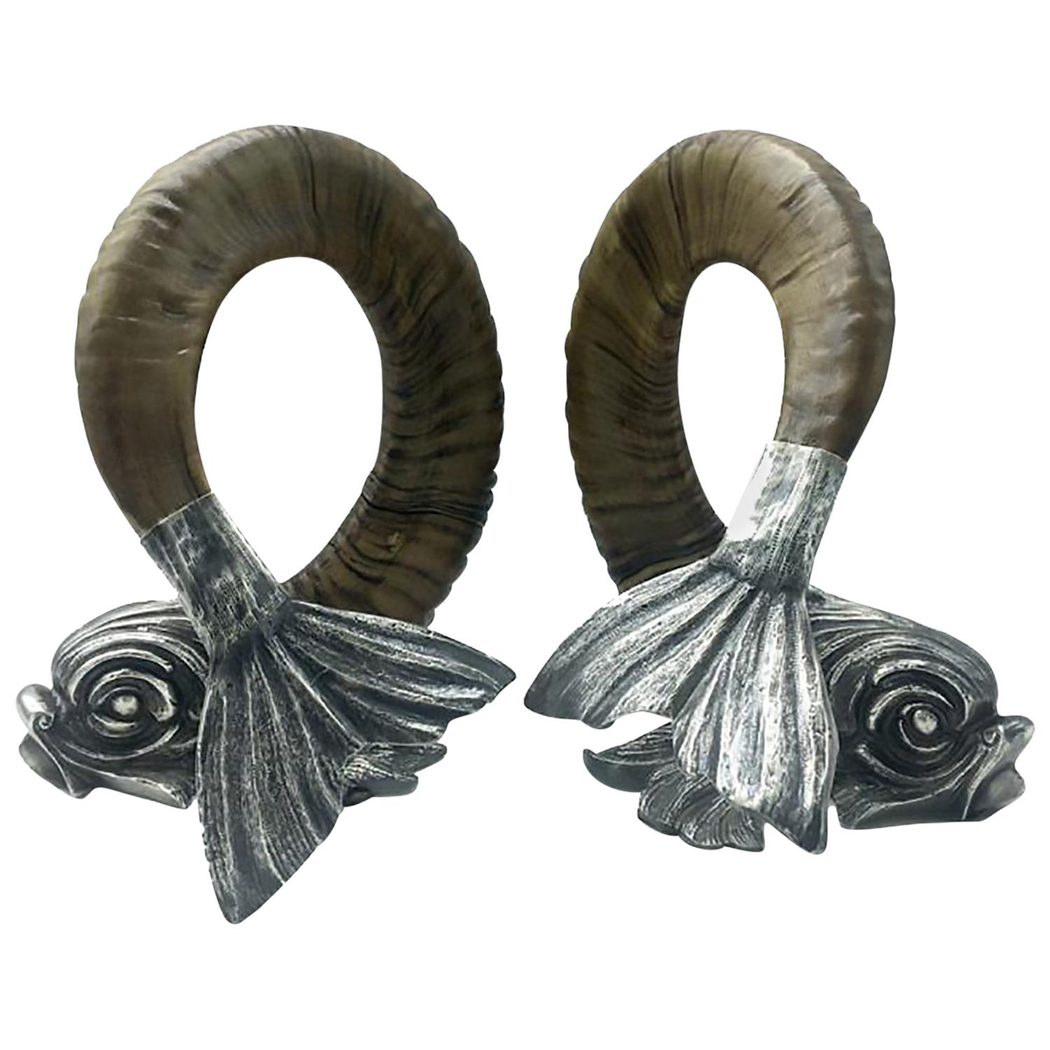 Pair of silver and horn dolphins by Gabriella Crespi.
Tabletop dolphins in ram’s horns fitted with silver head and tail, signed, 