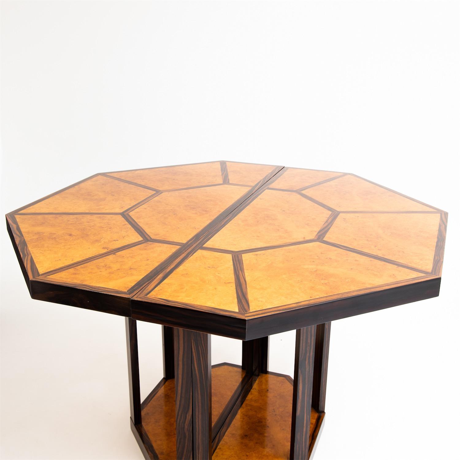 Multifunctional 'Puzzle' table by Gabriella Crespi (1922-2017) in octagonal shape on a central base, veneered in Thuja wood. The maximum dimensions of the table are 168.5 x 119 cm. If you remove the central piece, you get a table with 119 x 119 cm
