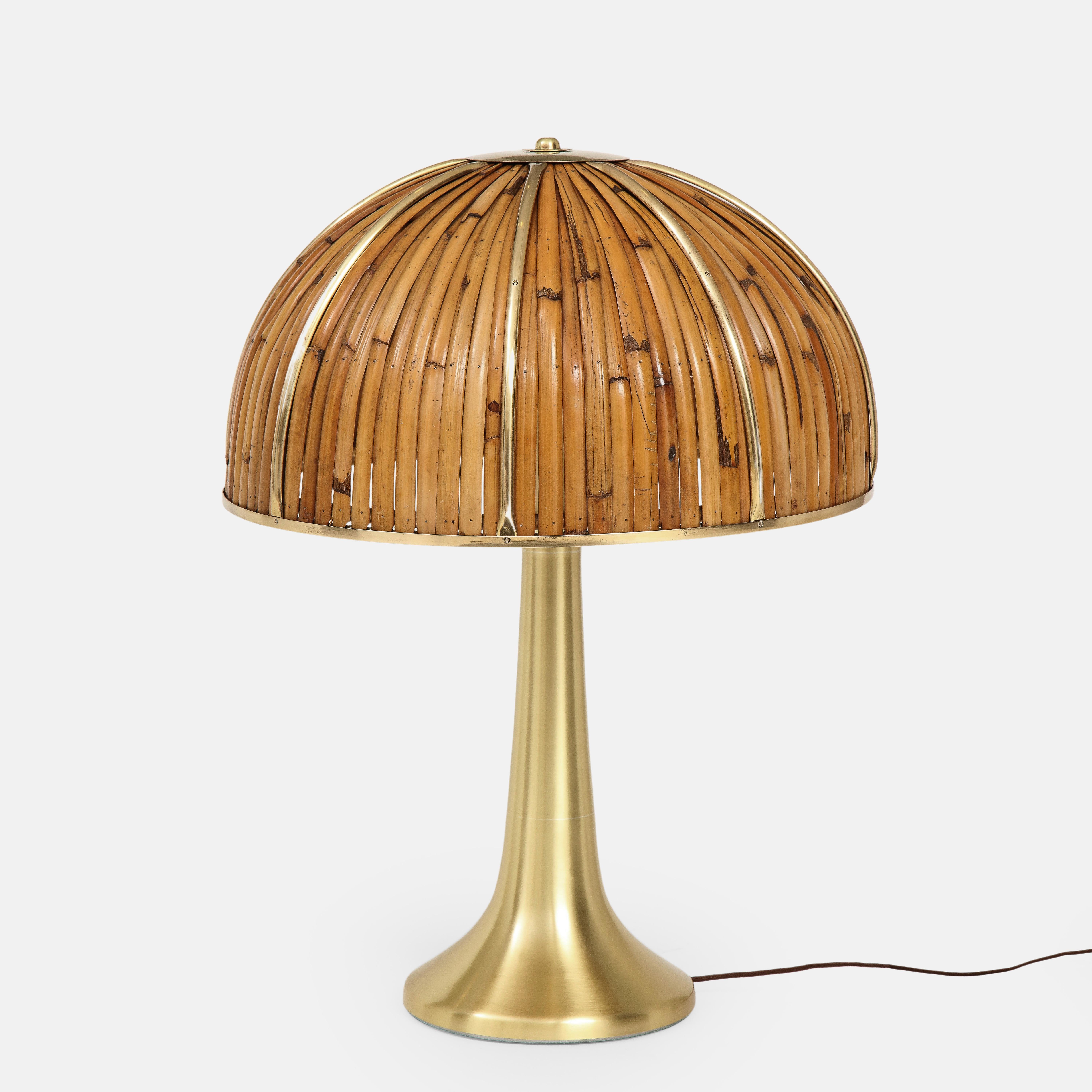 Gabriella Crespi rare large Fungo table lamp from the Rising Sun Series with lacquered bamboo strips and polished brass details on dome shade atop elegant flared brass base, Italy, 1970s.  Impressed with facsimile signature and artist’s cipher to