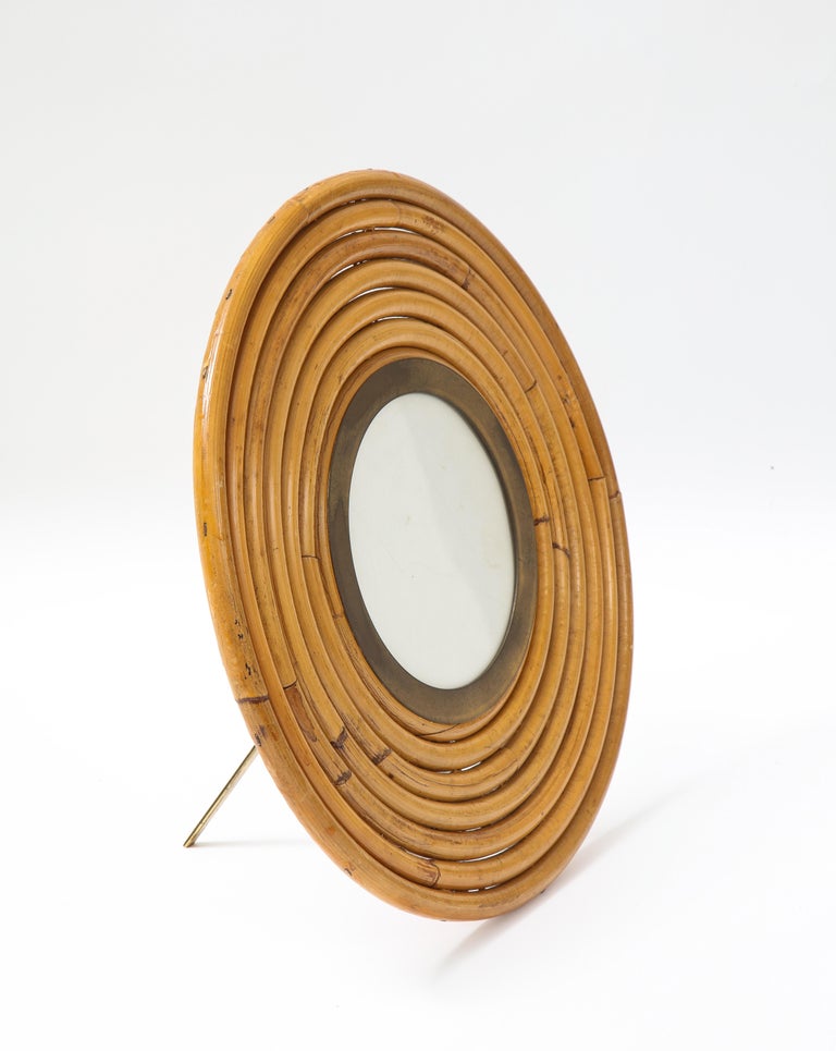Gabriella Crespi rare large round picture frame from the iconic Rising Sun series in bamboo and brass, Italy, 1970s.  This elegant bamboo frame is a striking example of Crespi’s deft use of natural material to beautifully create organic decorative