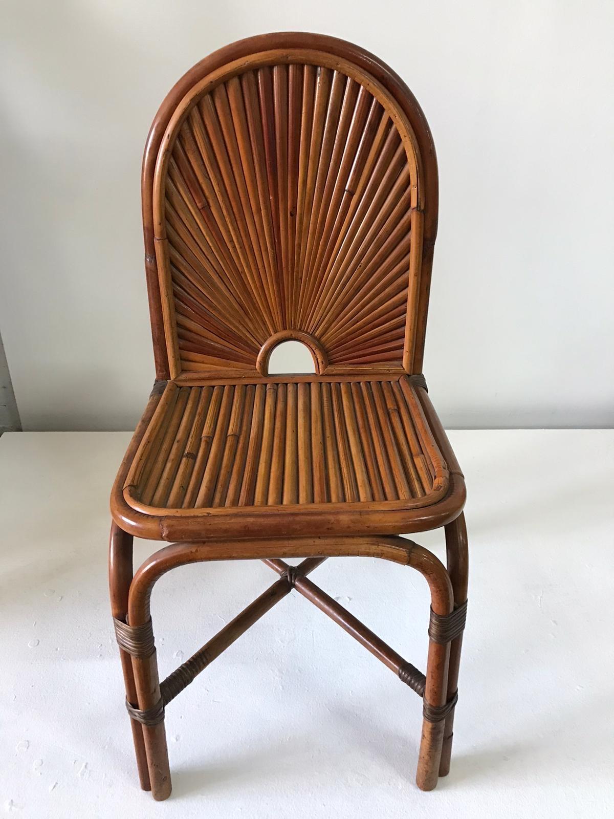 Set of eight bamboo dining chairs, each retain a metal Gabriella Crespi tag.  Great original vintage condition. The design is from the Rising Sun series designed and produced in Italy in 1974. These chairs are documented throughout Crespi's books