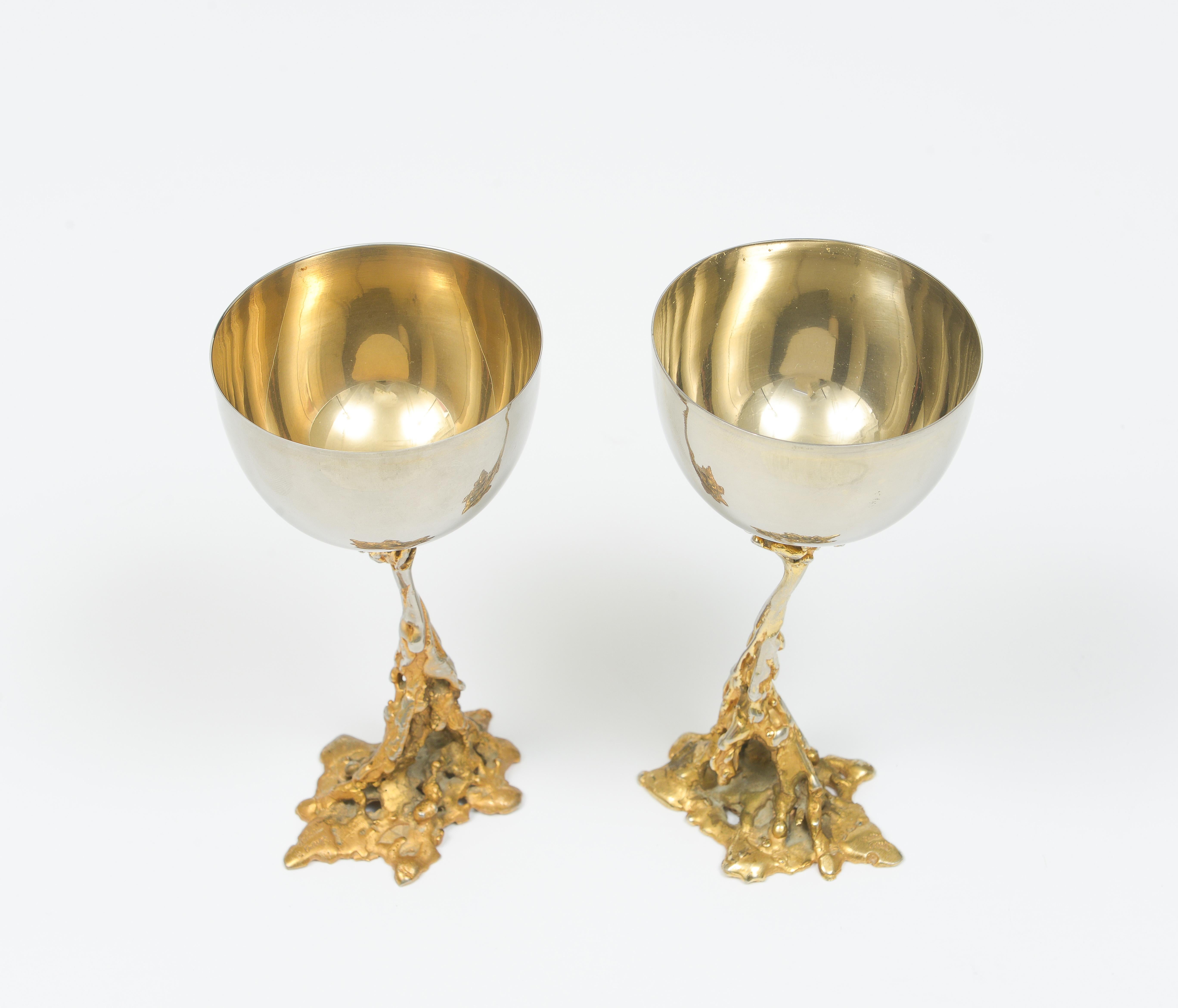 Gabriella Crespi signed brass chalices 1970 midcentury Italian

Dimensions: 3.5 in diameter, 7 in height, base 3 in.

About Gabriella Crespi (Designer)
Bronze discs that open up like clamshells for storage and fold back in to become side
