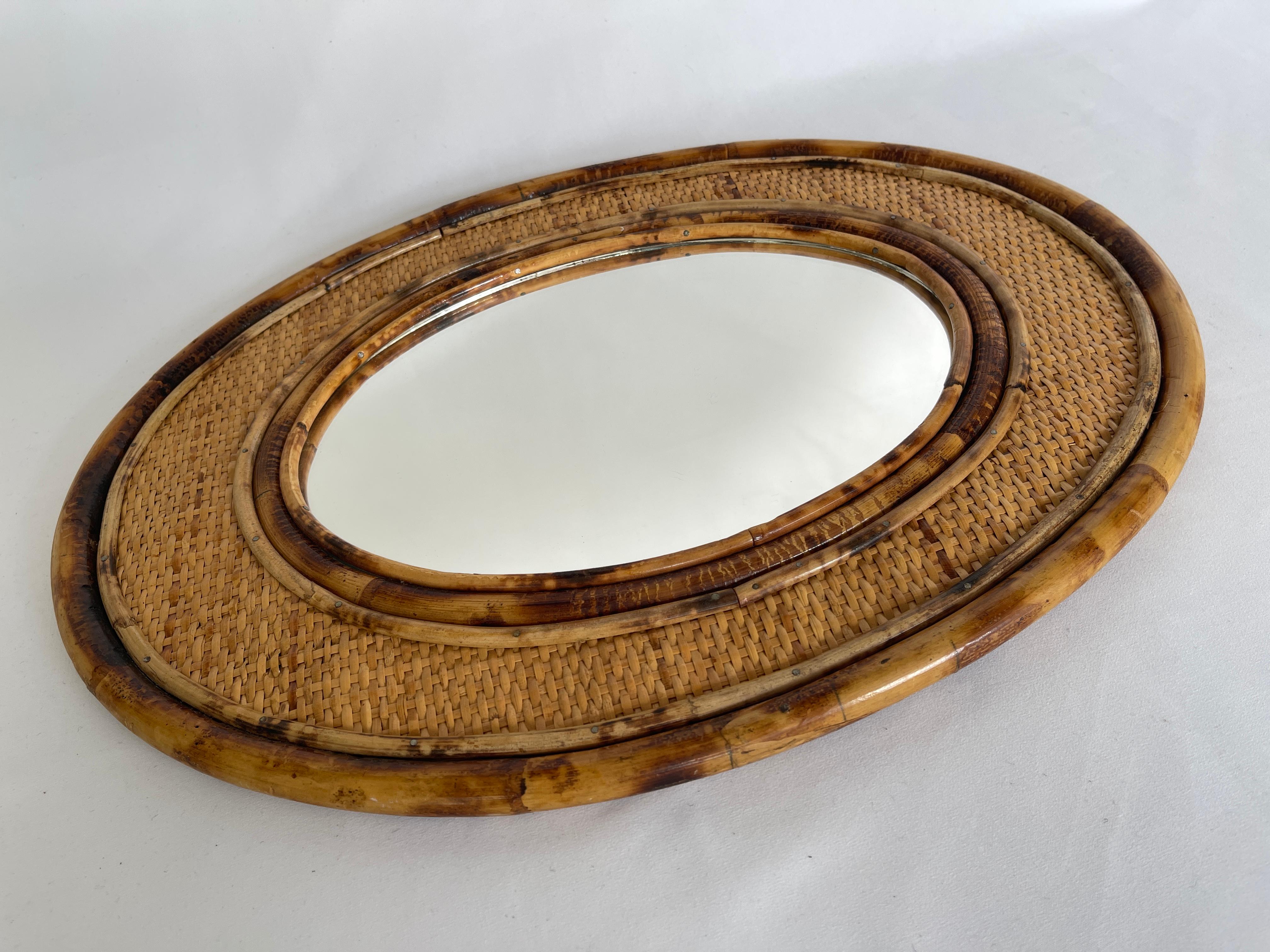 International Style  1970's Bamboo Framed Rattan Oval Mirror
