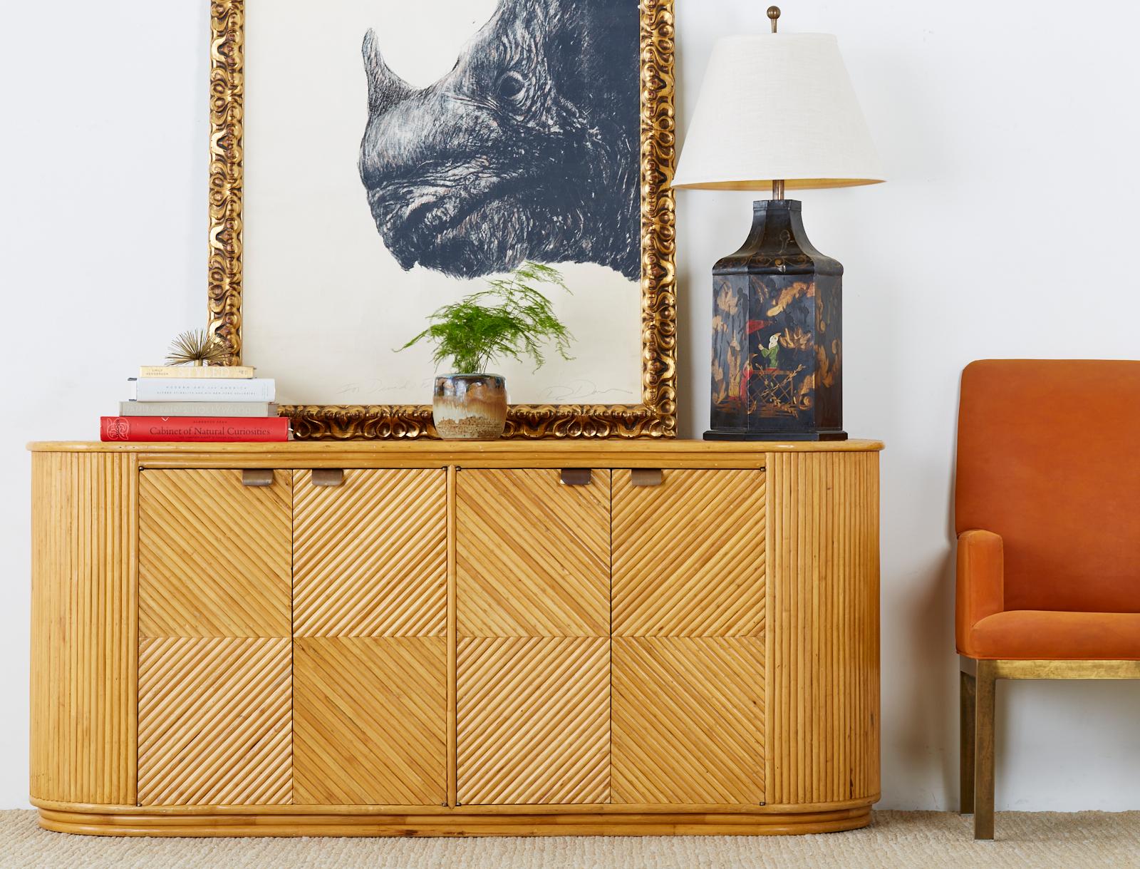 This sideboard server represents everything wonderful about the modern use of rattan. Incredible geometric patterns abound reminiscent of Art deco with modern shapes and lines. While touching modernism the rattan shape keeps the piece grounded in