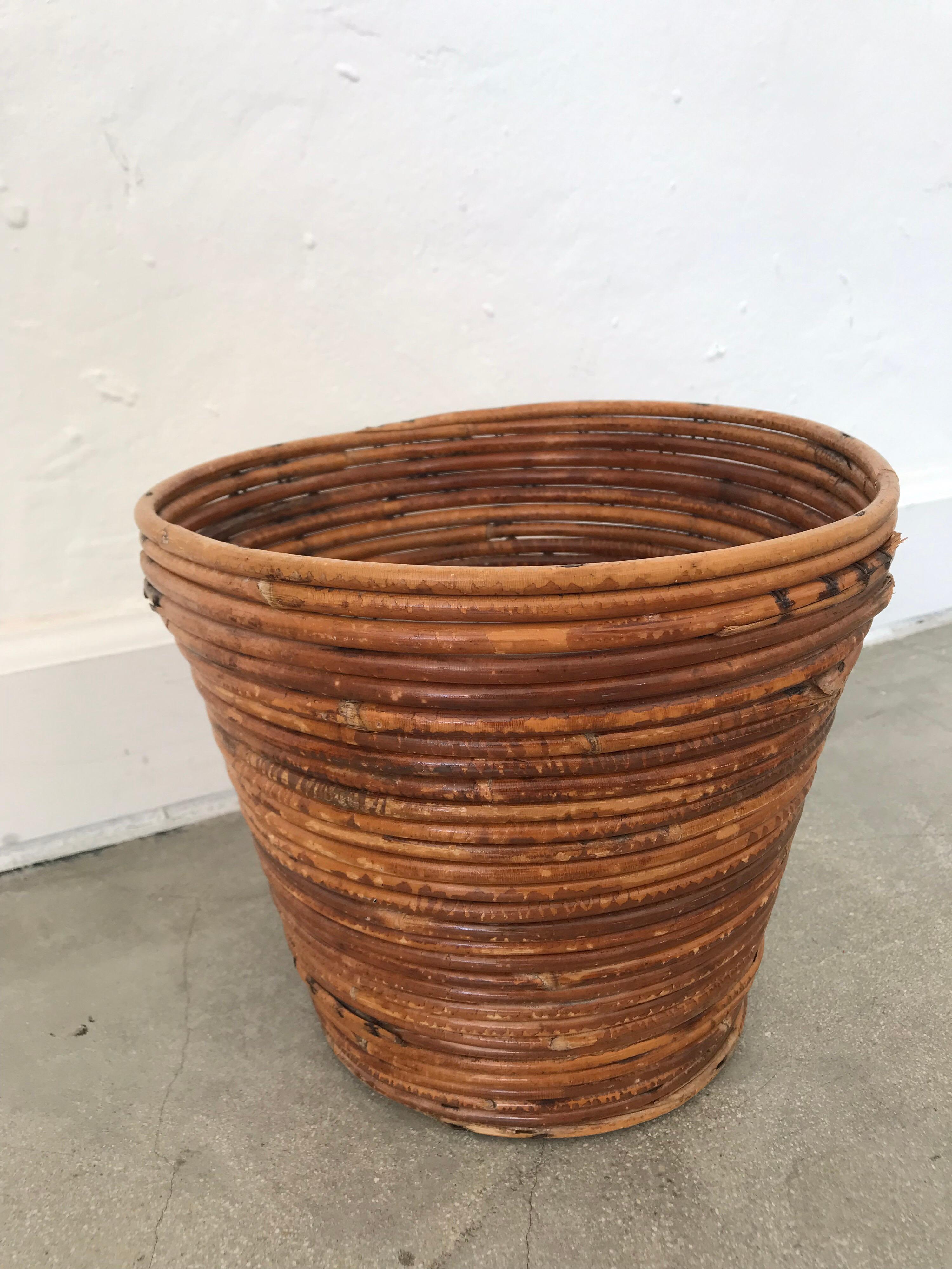 Organic mid century waste basket, trash bin, or trash can, rendered in bamboo split reed rattan.