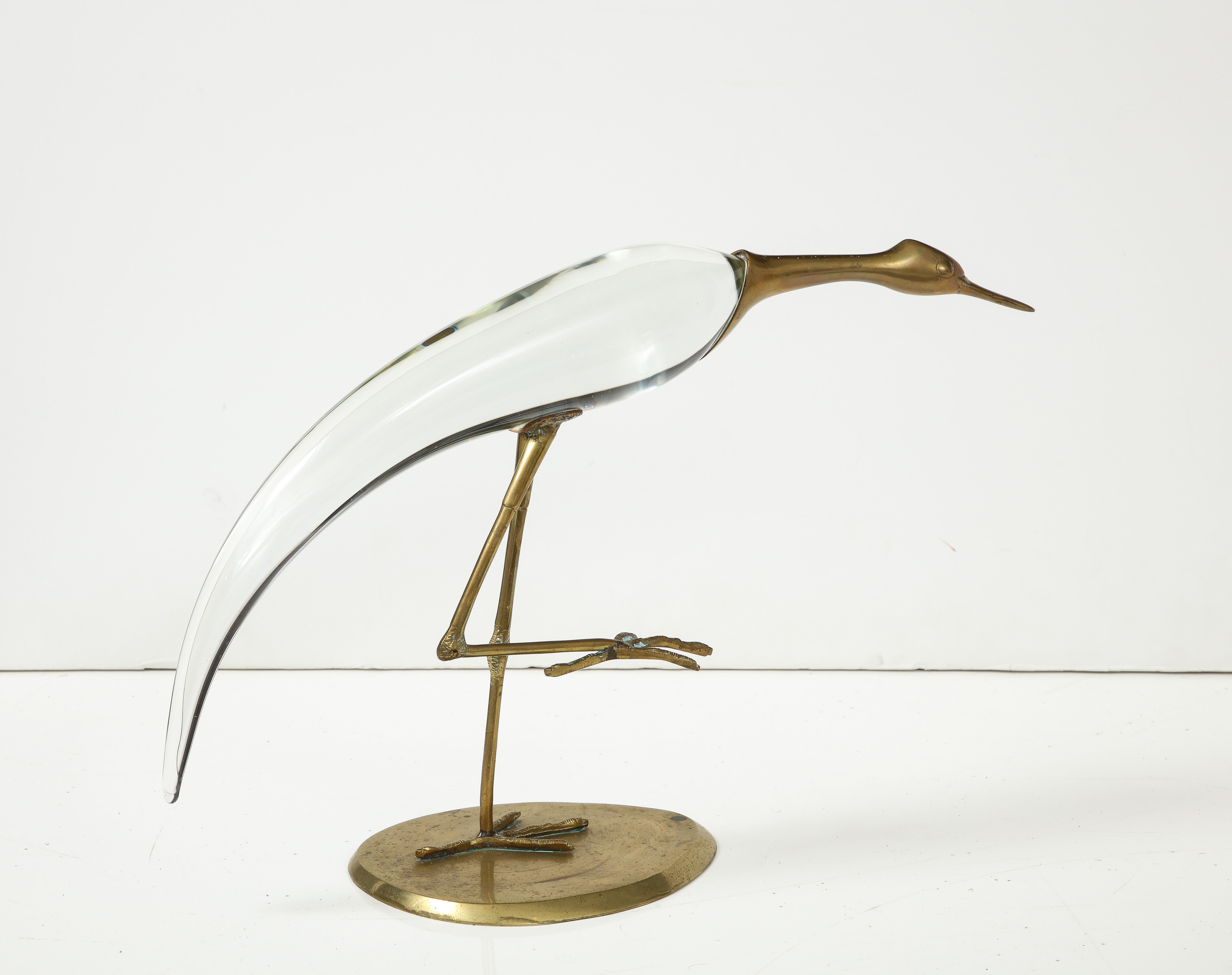 Midcentury stylized Egret bird sculpture featuring brass beak, feet, stand and a sinuous art glass body.