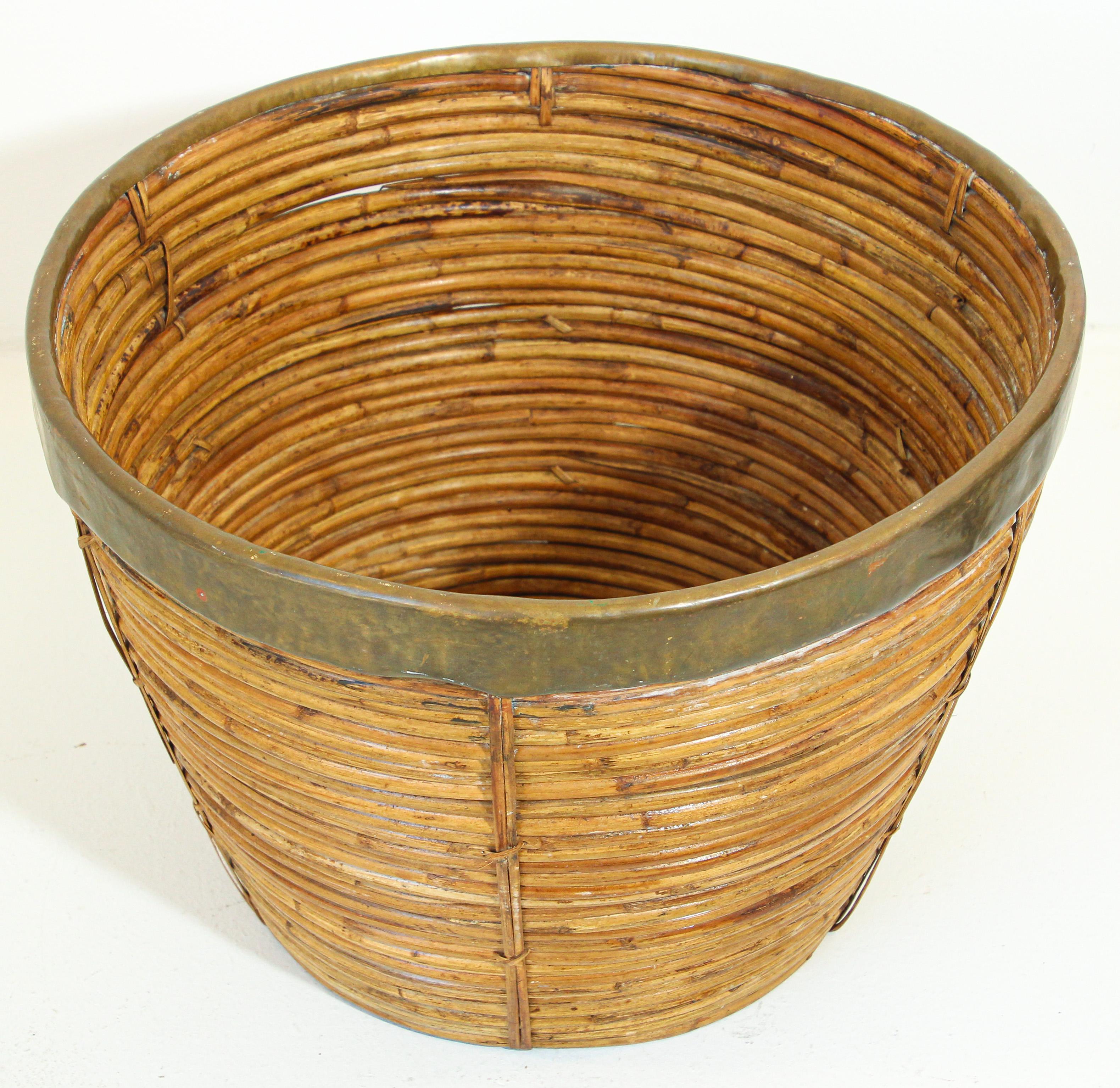 Large brass and rattan bamboo planter or basket.
Vintage Mid-Century Modern decorative handcrafted brass and rattan bamboo large planter.
Round shape with gilded brass rim.
Can be use as a planter or large decorative basket or