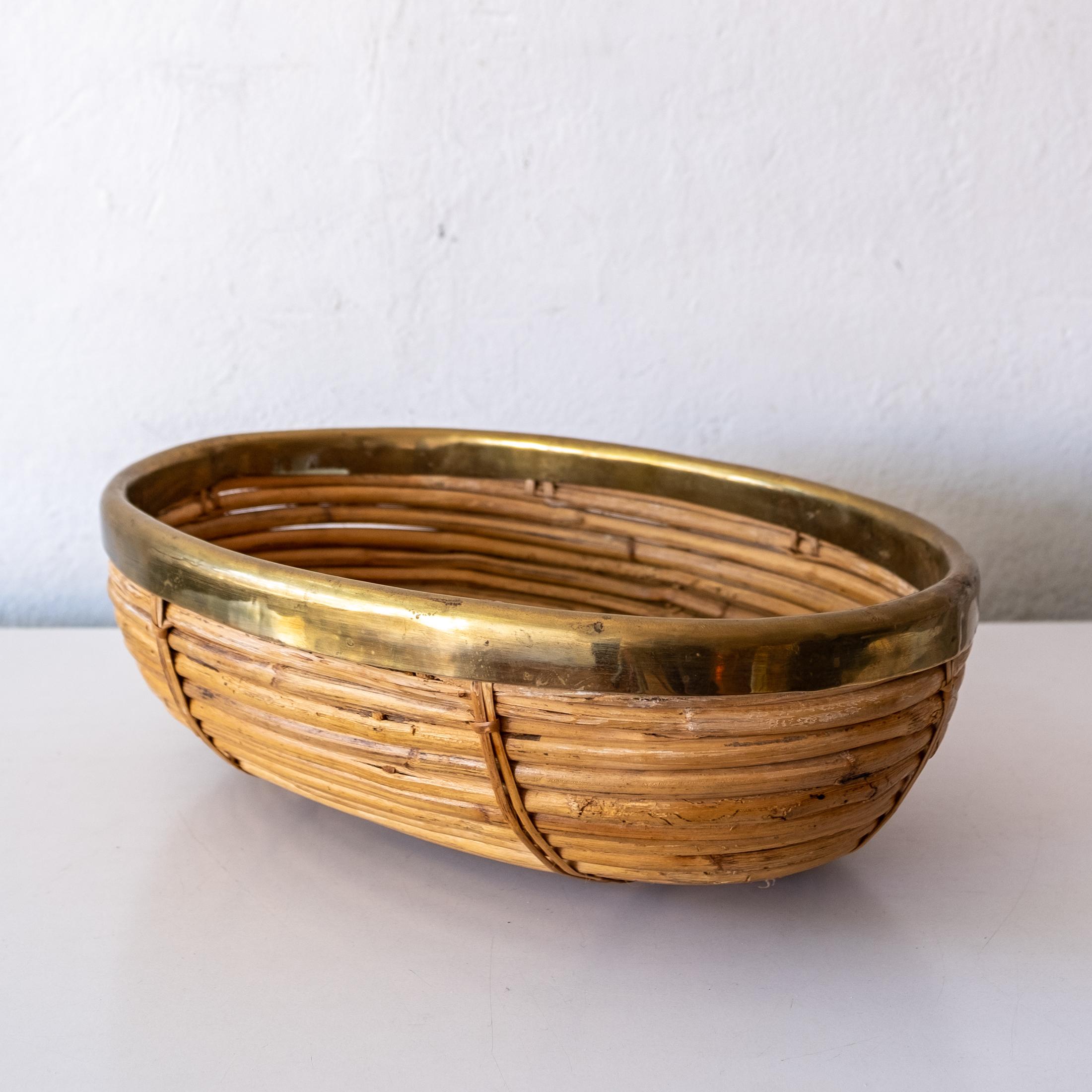 Can wrapped pencil reed and brass catch all basket or bowl in the style of Gabriella Crespi. 1960s, Italy.