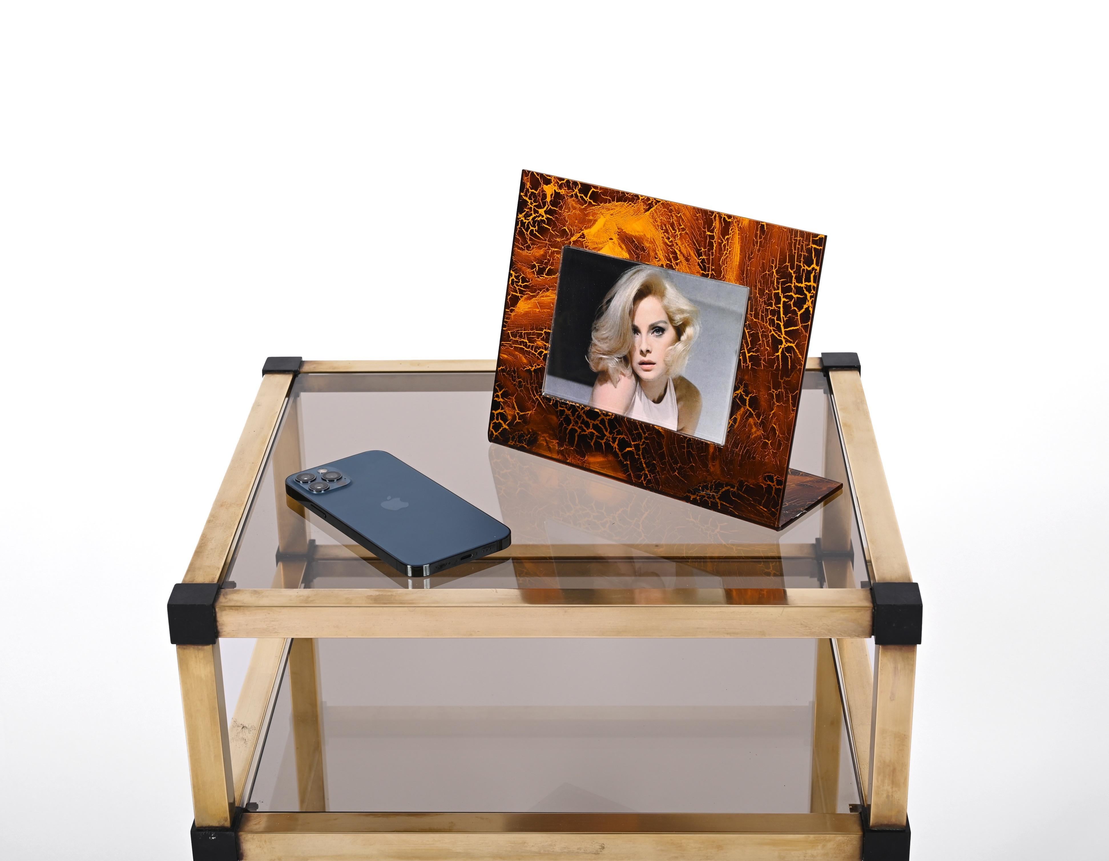 Gorgeous photo frame in lucite with a stunning tortoiseshell effect. This elegant piece was produced in Italy in the 1970s and attributable to Gabriella Crespi.

This stunning piece is perfect to enhance a modern studio or a mid-century living