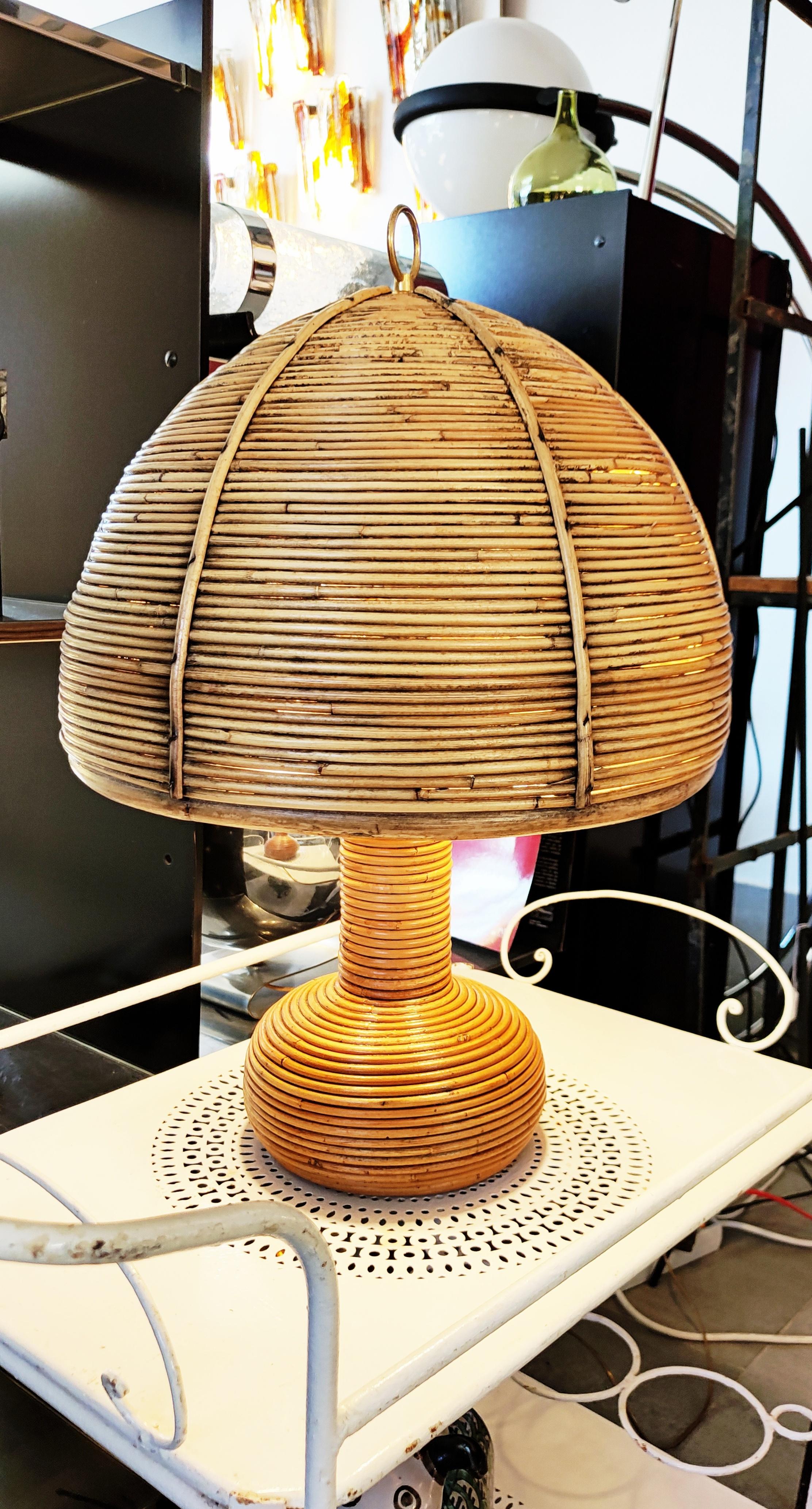 Rare large rattan and bamboo table lamp manufactured in 1970s in Italy.
In perfect vintage condition. The whole structure of the assembly of the lamp is in brass, very good quality and very beautiful realization for this lamp from the 1970s.