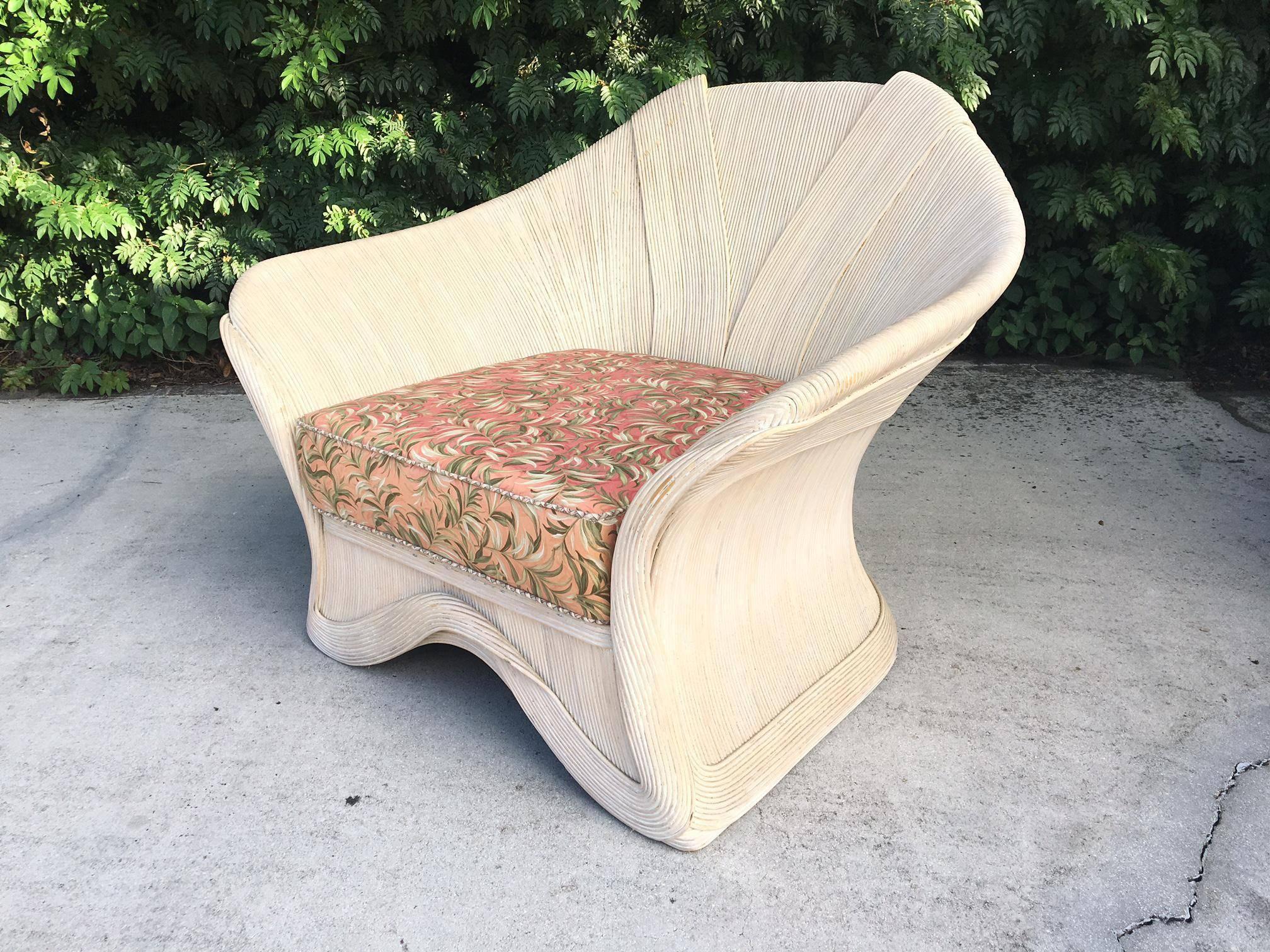 Vintage Palm Beach style rattan club chair in the style of Gabriella Crespi. Natural finish and thick seat cushion make this chair as comfortable as it is beautiful. Good vintage condition with abrasions consistent with age.
Measure: Seat height is